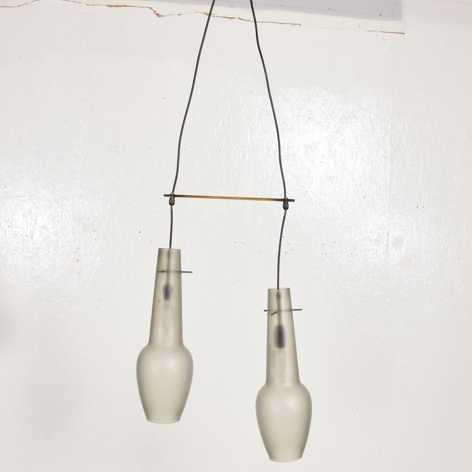 For your consideration, Mid-Century Modern Italian pendant chandelier with two frosted glass shades, Stilnovo era.

Made in Italy, circa 1960s. It requires two E-14 bulbs. Beautiful original condition. Brass has vintage patina.

Dimensions: 50