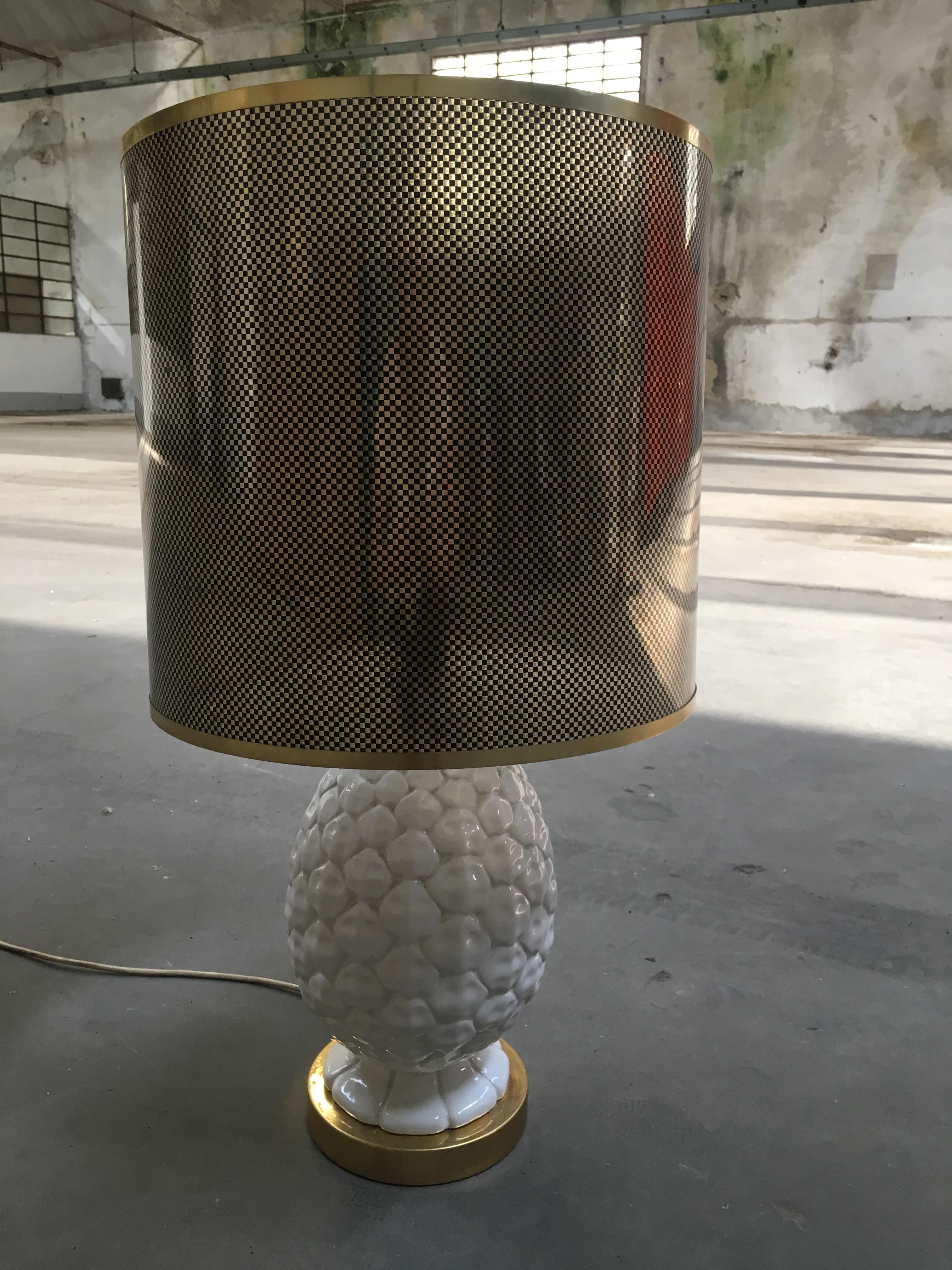 Mid-Century Modern Italian ceramic table lamp with gilt metal basement and original acrylic lampshade from 1970s.
The lamp has European electrification.
Measurements:
Table lamp: Diameter cm. 18 x height cm. 46
Lampshade: Diameter cm. 38 x