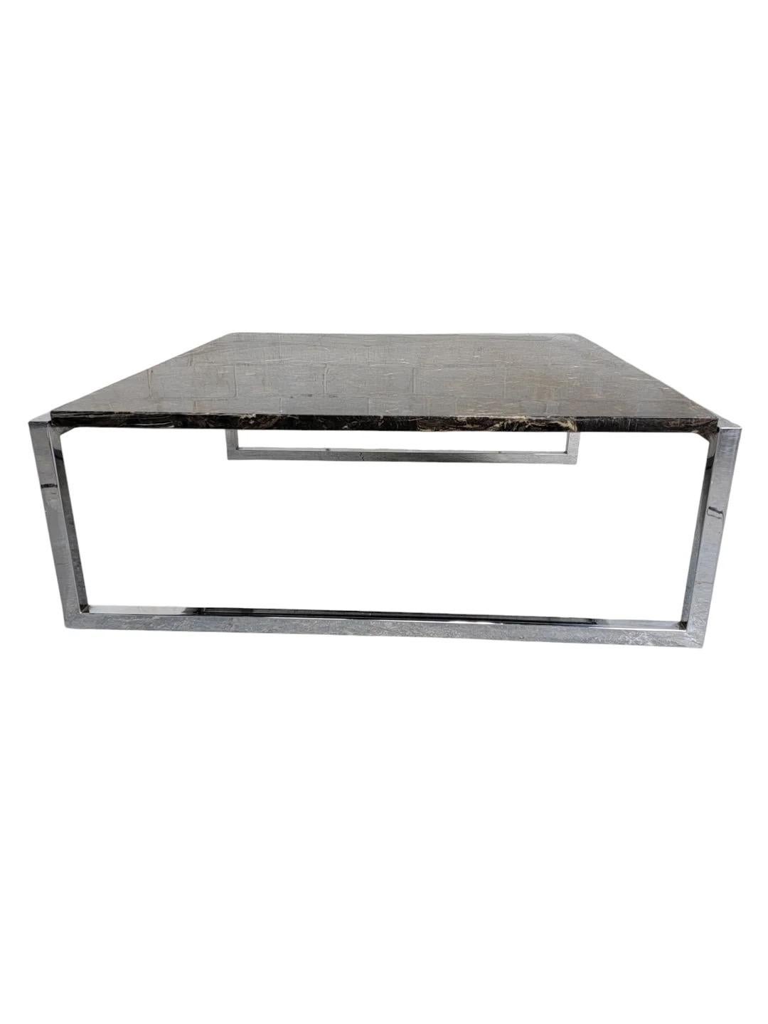 Mid Century Modern Italian Polished Granite Chrome Sled Base Square Coffee Table

The sturdy chrome sled base provides both stability and a contemporary aesthetic, making it a perfect addition to any modern living space. Its square design offers