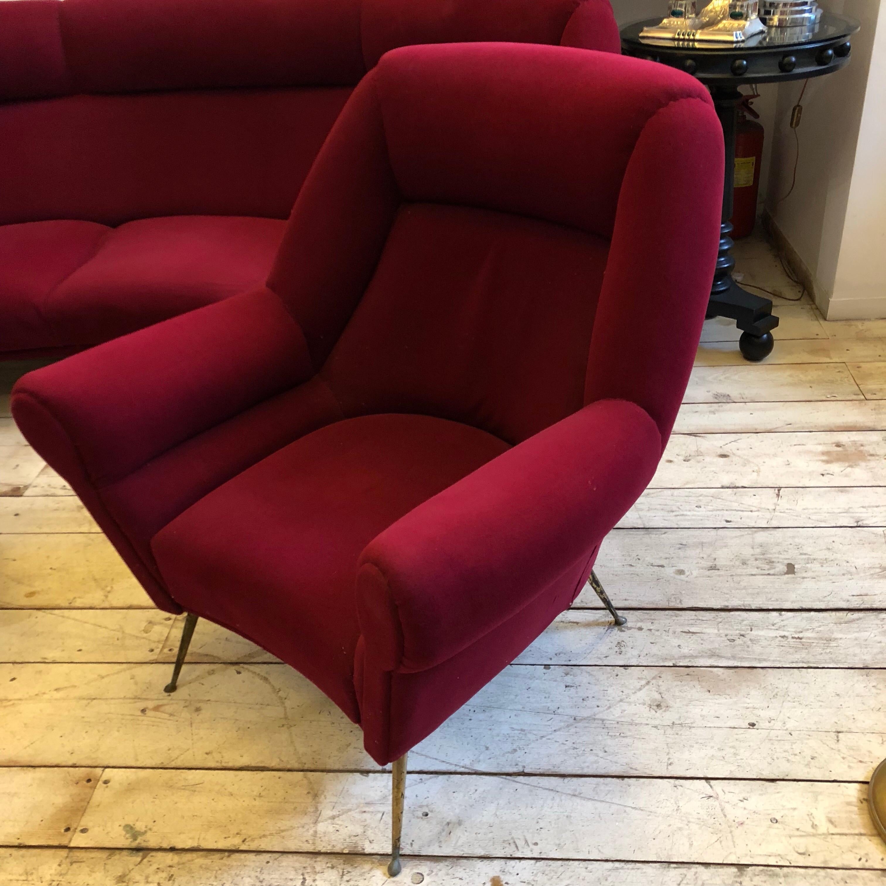 Amazing red velvet curved sofa and two armchairs in the style of Gio Ponti. Brass feet are in original patina, tissue is in very good conditions, only a little scratch showed in a photo. Made in Italy in the 1950s.
Measures: Armchairs size height