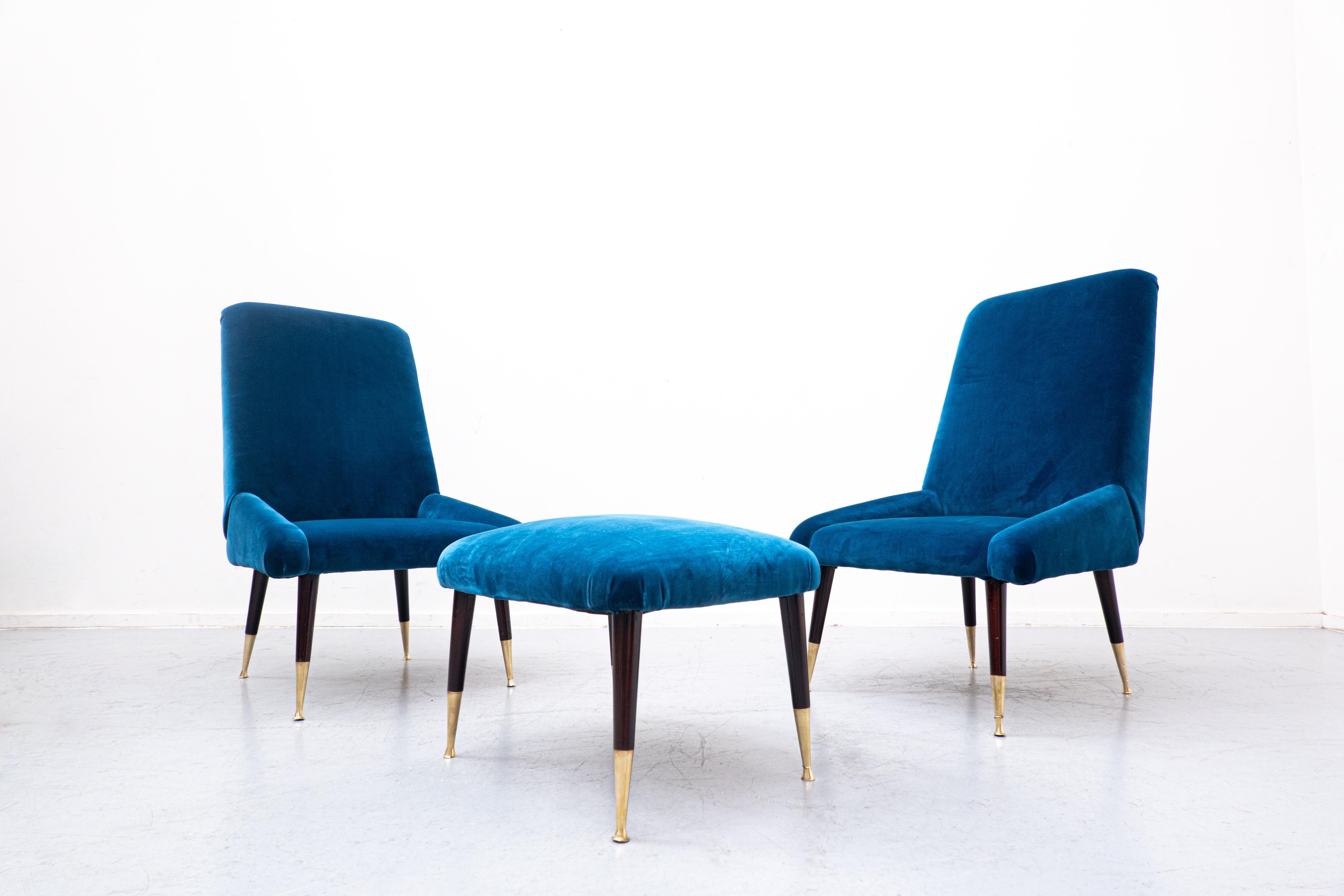 Mid-Century Modern Italian seating set, blue velvet, 1950s
European. 
Two armchairs and one ottoman

Dimensions Ottoman : 
50 W x 38 D x34 H.