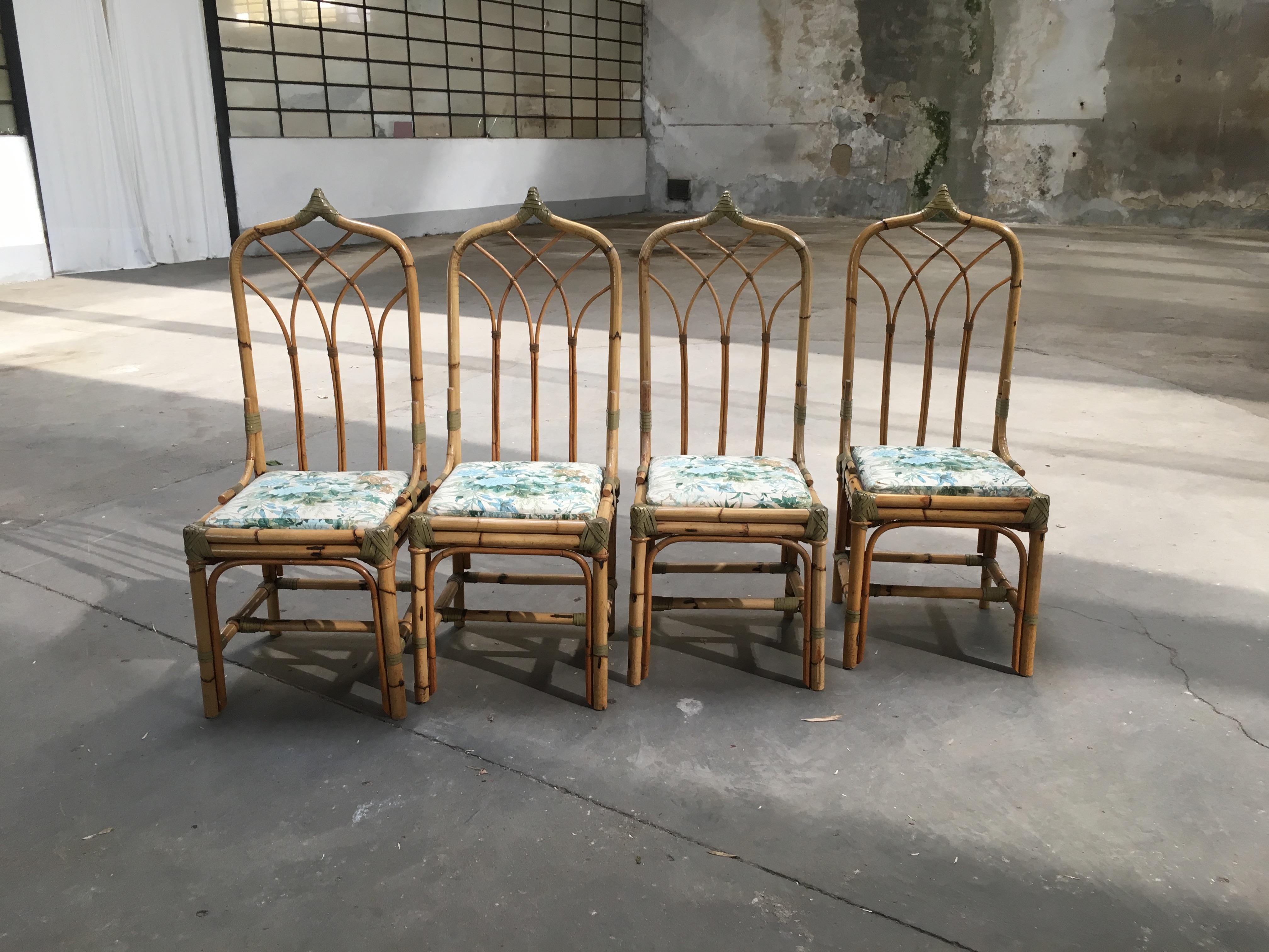 Mid-Century Modern set of 4 bamboo Italian chairs with original floral cushions
 All the binding of the chairs are made with leather laces. 
If needed, the chairs could be sold together with their dining table as shown in the pictures.
Quotation