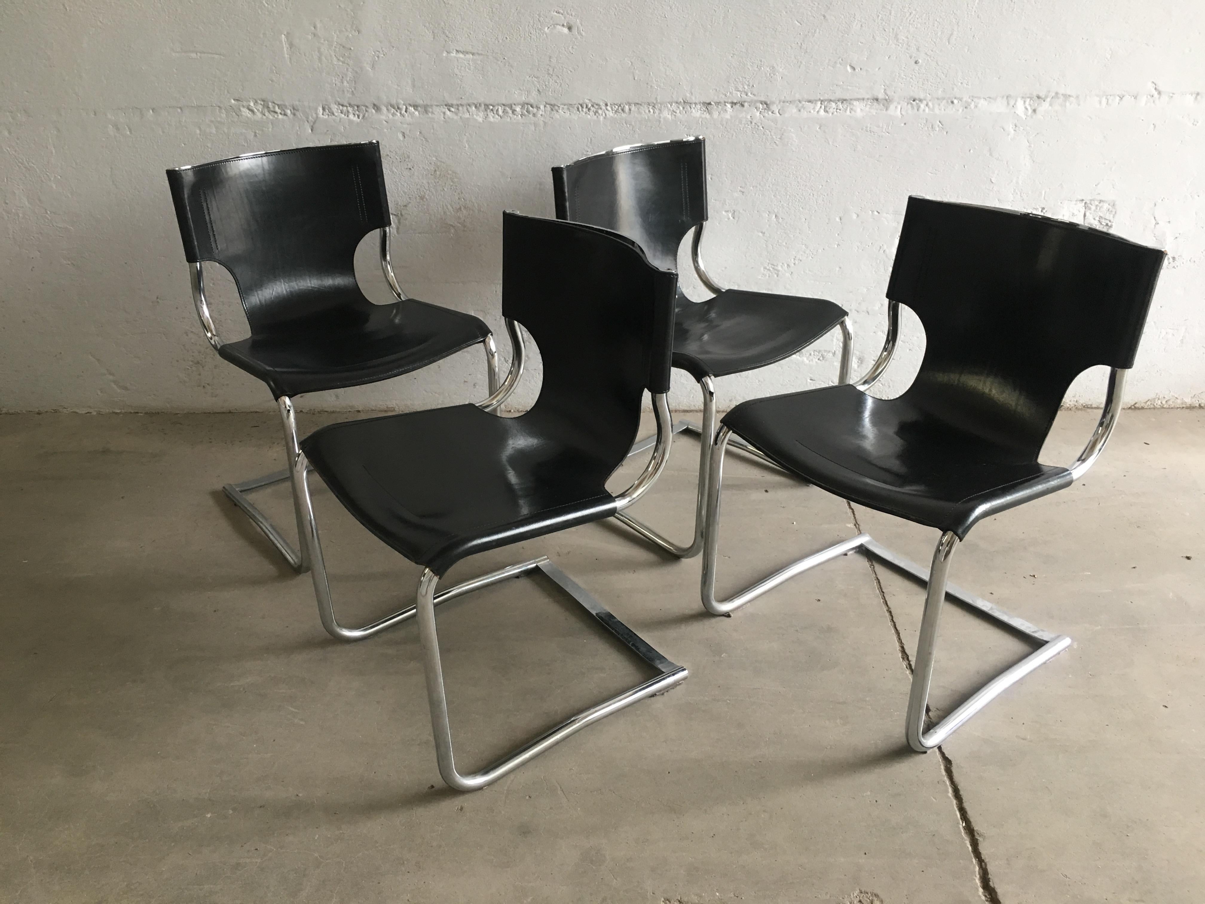 Mid-Century Modern set of four Italian chrome and black leather dining or office chairs, 1970s.