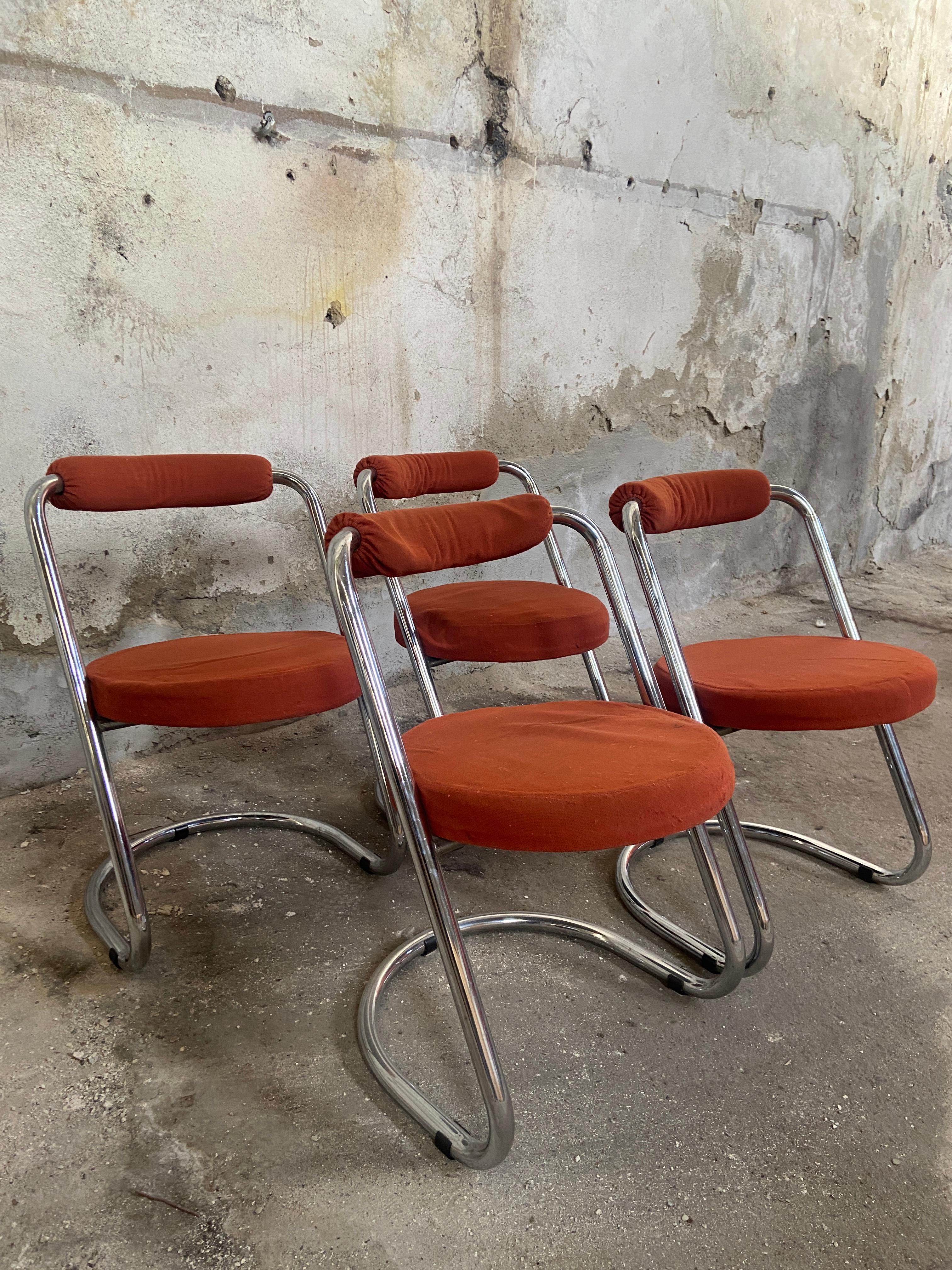 Mid-Century Modern Italian set of Giotto Stoppino chairs with chrome structure and original fabric apholstery in brick-colored.
If needed the chairs available are 5 pieces.
The fabric shows clear signs of wear and tear and should be replaced.