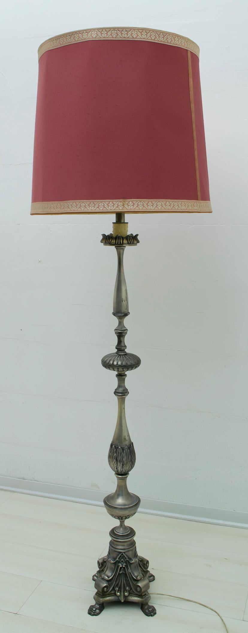 This beautiful silver plated brass floor lamp was produced in Italy in the neoclassical style.


