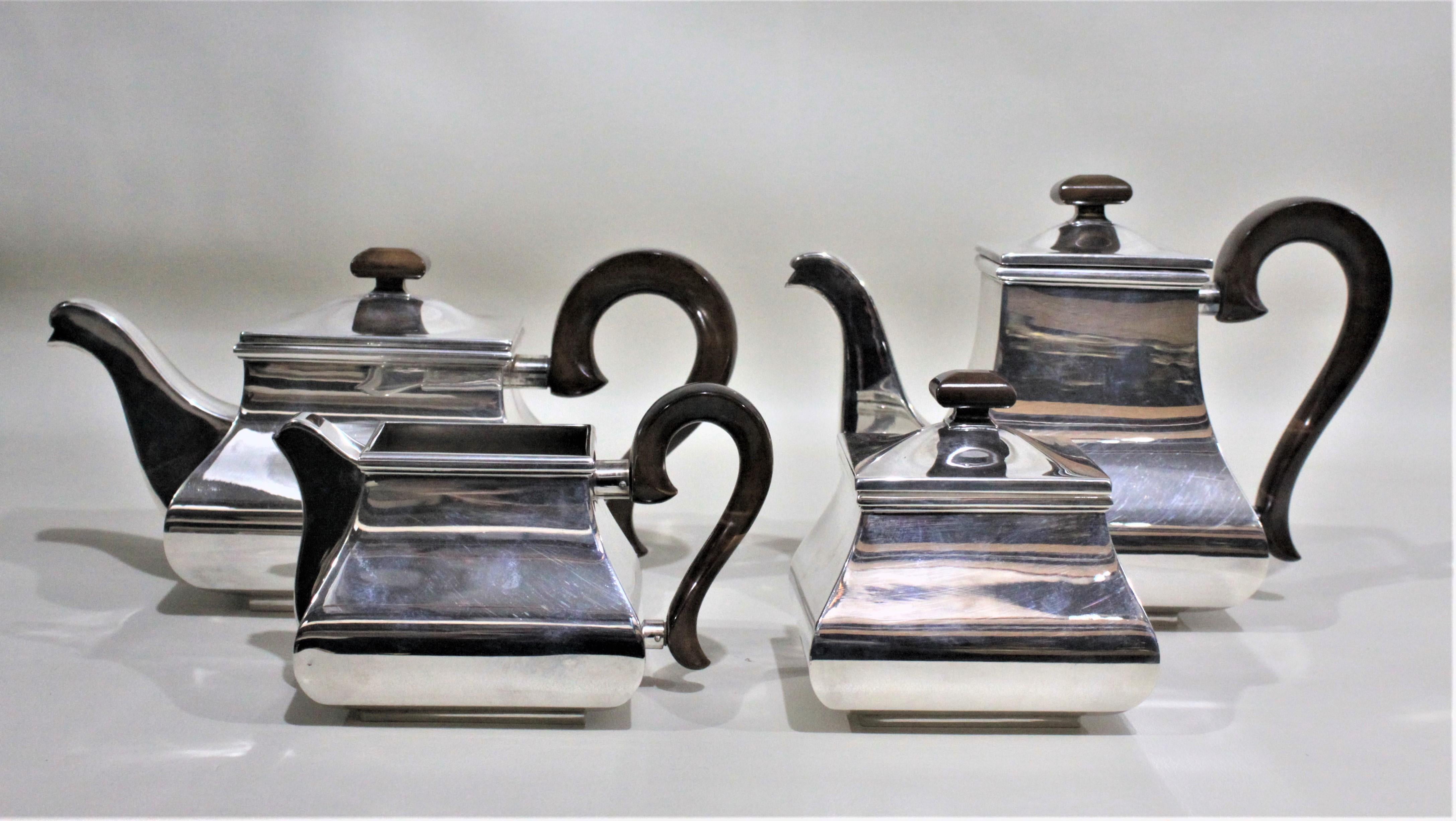 This four piece silver plated tea or coffee set was made in Italy in approximately 1970 in the Mid-Century Modern style. The set was produced by Marango and each piece is clearly marked on the bottom and several also have their original labels. This