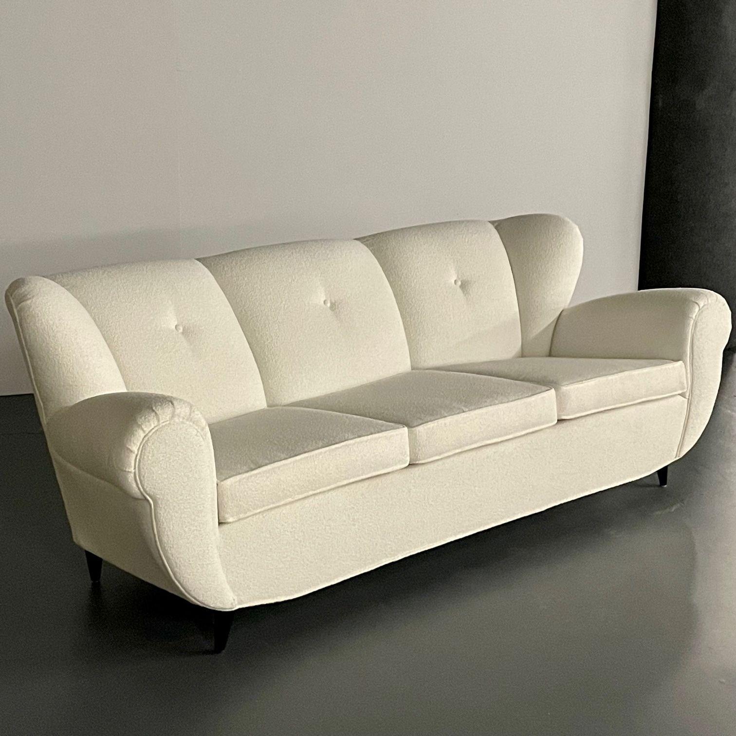 Mid-Century Modern Italian Sofa by Guglielmo Ulrich, Art Deco Style, Boucle, 1940s

Italian organic form sofa or settee by architect, designer and painter, Guglielmo Ulrich. The upper comprised of a premium nubby white boucle sitting on four low