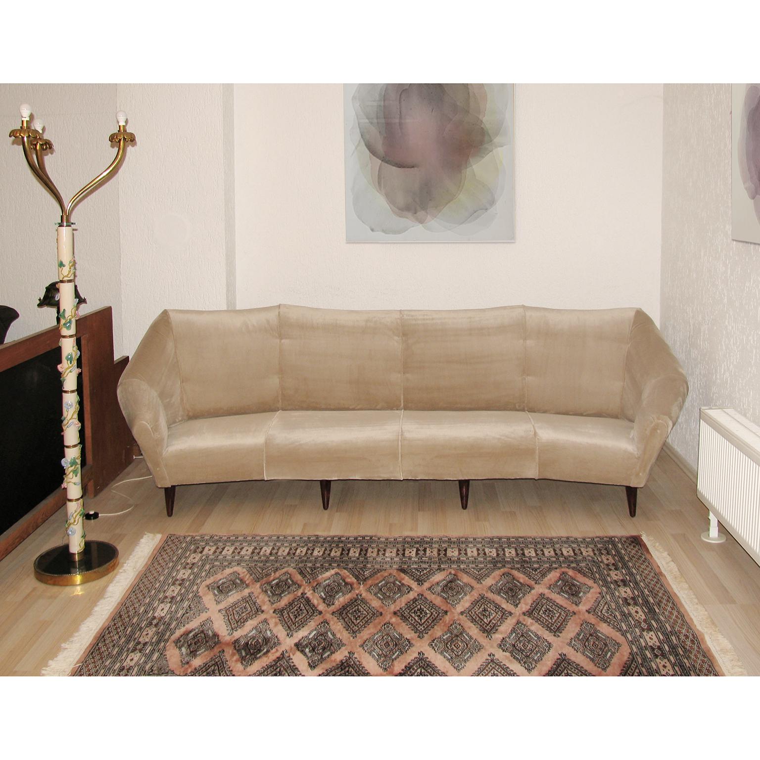 Large sofa, four seats, designed by Enzo Minotti, Mid-Century Modern, 1950s.
Wooden structure reupholstered in luxurious Rubelli velvet. Wood feet.
Angular shaped design, with comfortable arms.
Dimensions:
Width 285 cm (9 ft and 4.21 inches),