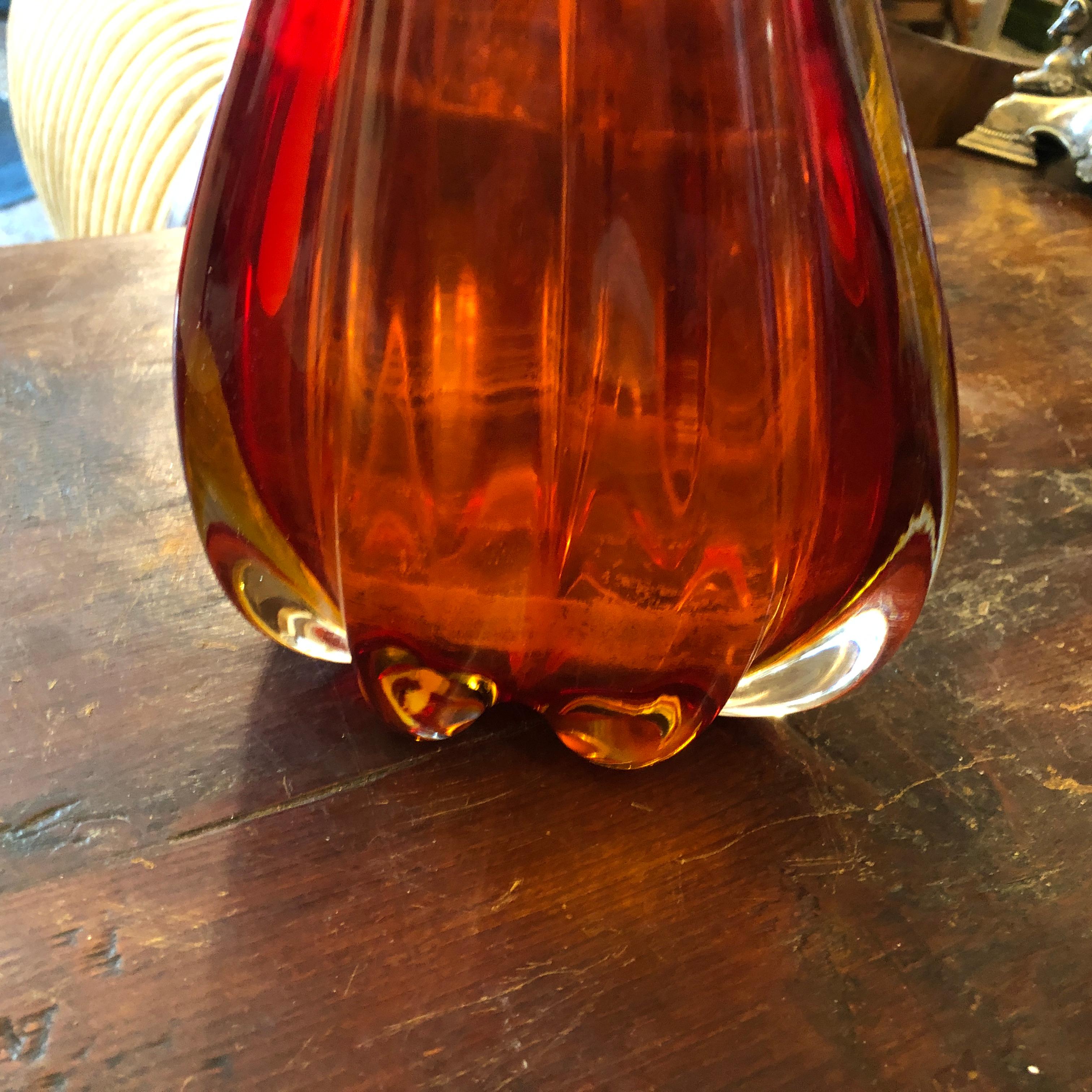 A particular Mid-Century Modern red Murano glass vase designed by Flavio Poli and manufactured by Seguso, it's in perfect conditions. The Murano Glass Jug Vase is a striking representation of the innovative glass artistry of the time, combining