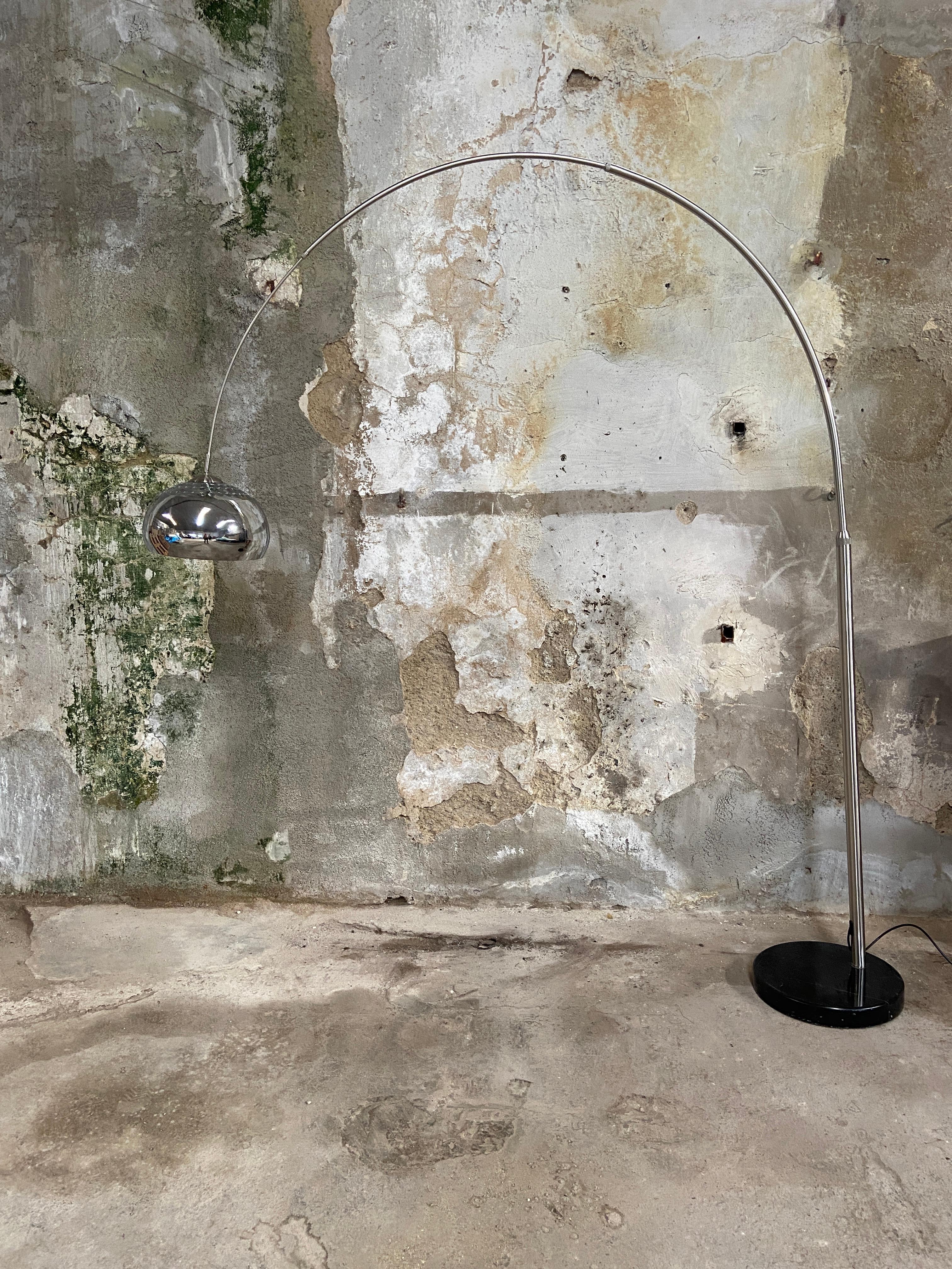 Mid-Century Modern Italian chrome stainless steel arc retractable floor lamp with Belgian black marble base, 1970s.
This lamp comes with European electrification.
 