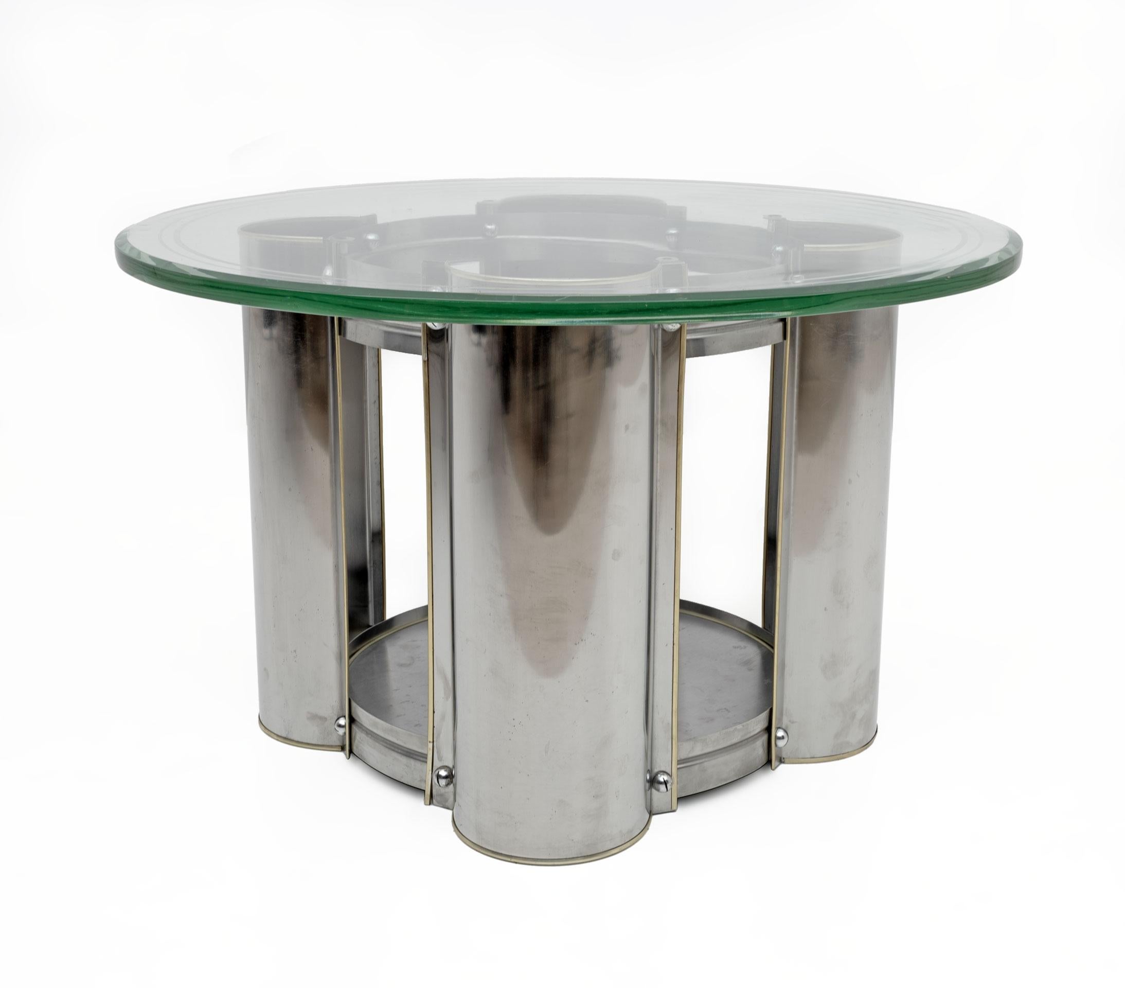 Steel table and very thick glass top, the surface below acts as a bottle holder. Italian production from the 70s,
Small signs of aging