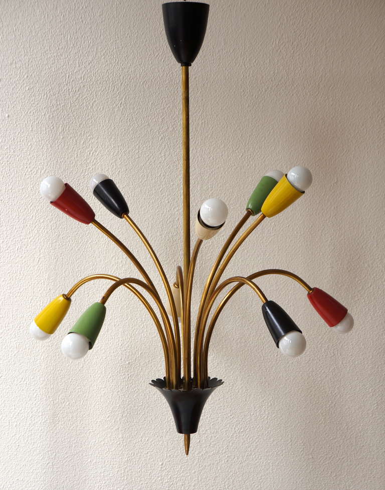 Large Italian Stilnovo style chandelier with 10 arms in brass with trumpet diabolo shades enameled in different colors.
Great original / vintage condition. 
Holds E14 bulbs Made in Italy, circa 1950.



 