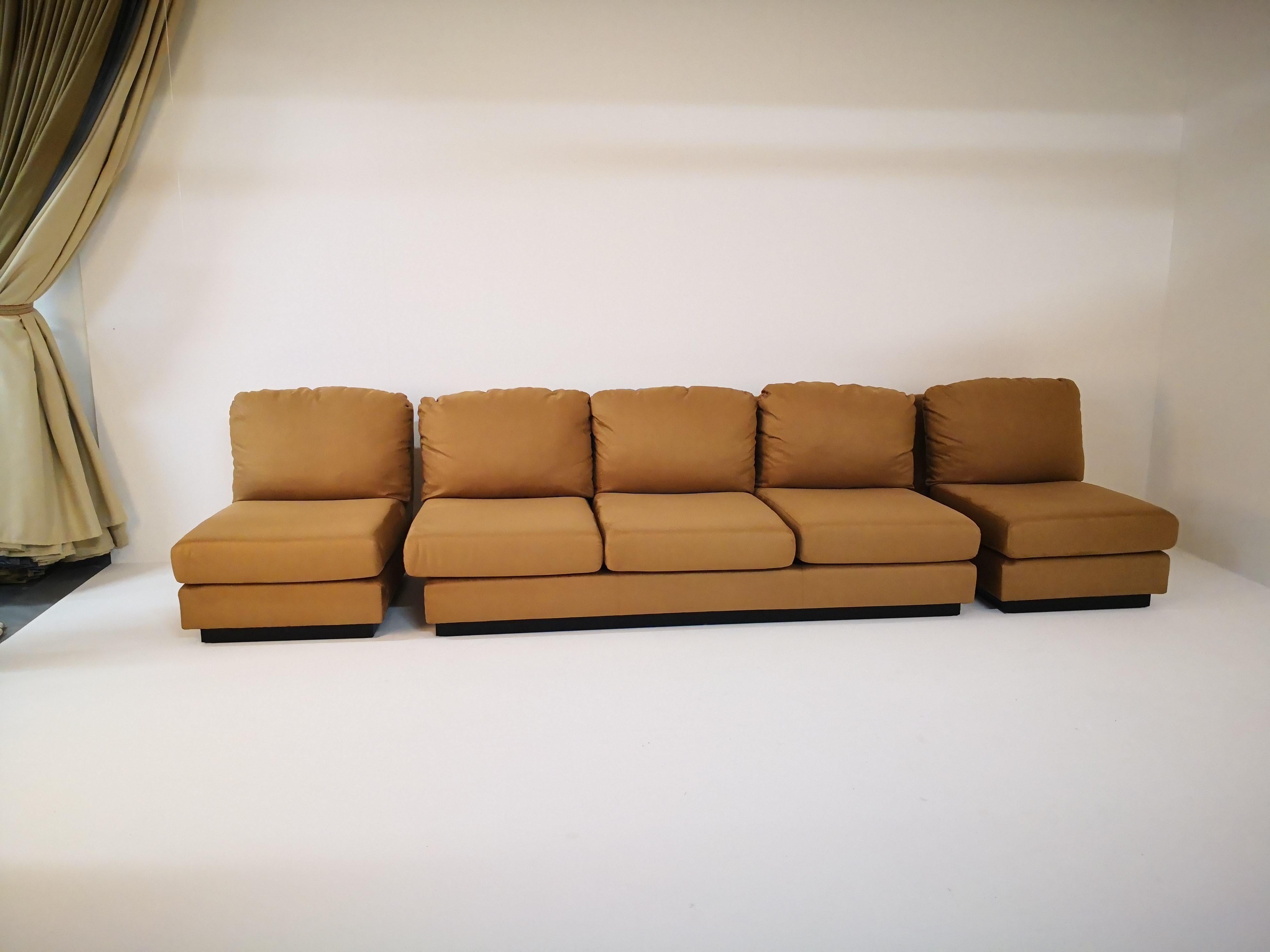 Extremely rare living set by Willy Rizzo finished in suede with wood laquer bases. The set consists in 1 sofa and 2 armchairs. This iconic design featured prominently in the prestigious Italian design periodical 'Casa Vogue' throughout the early to