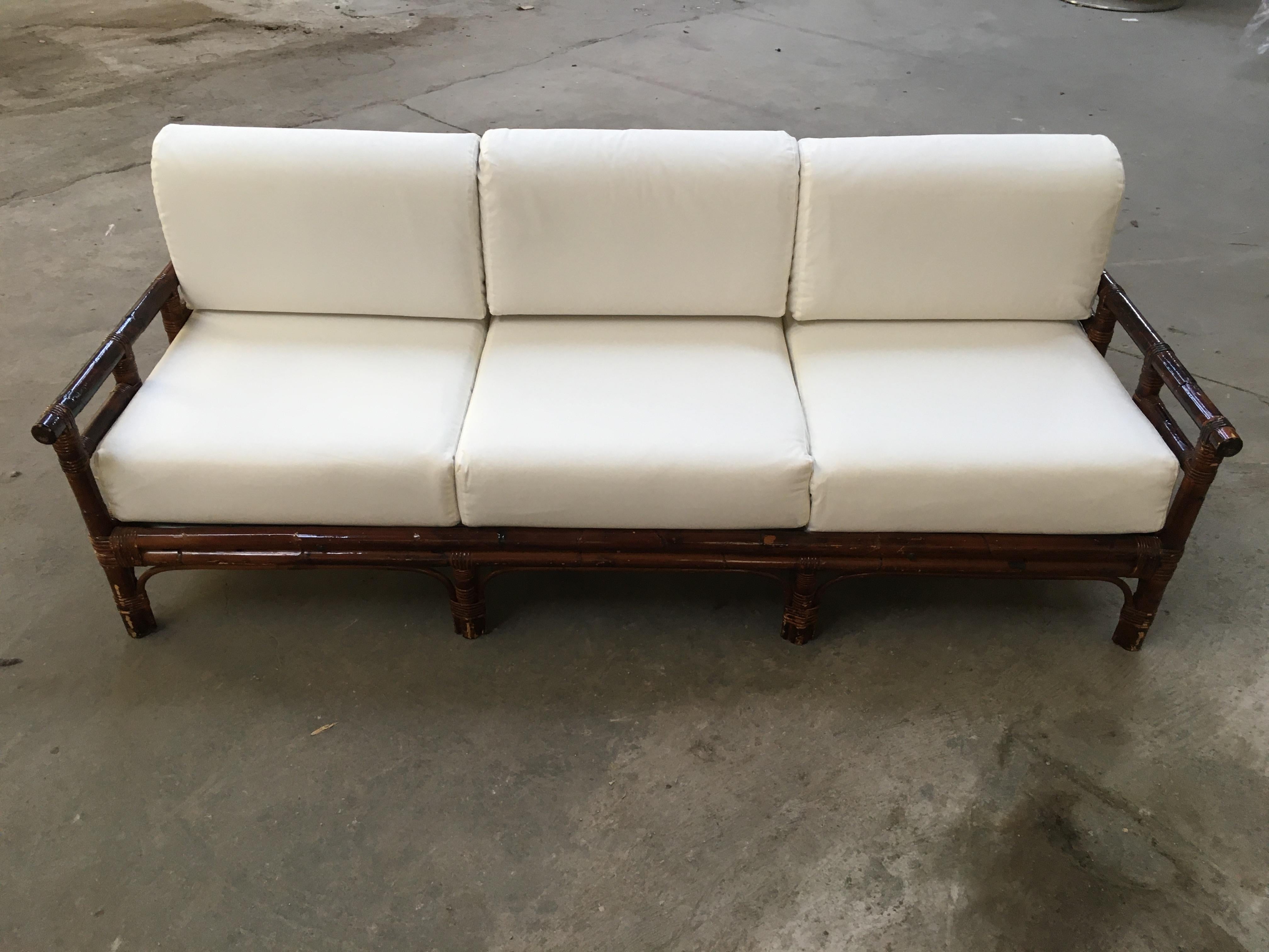 Mid-Century Modern Italian three-seat bamboo sofa with reupholstered cushions from 1970s.
The cushions have been covered with white cotton to give the chance to recover them with the right selected fabric.
  