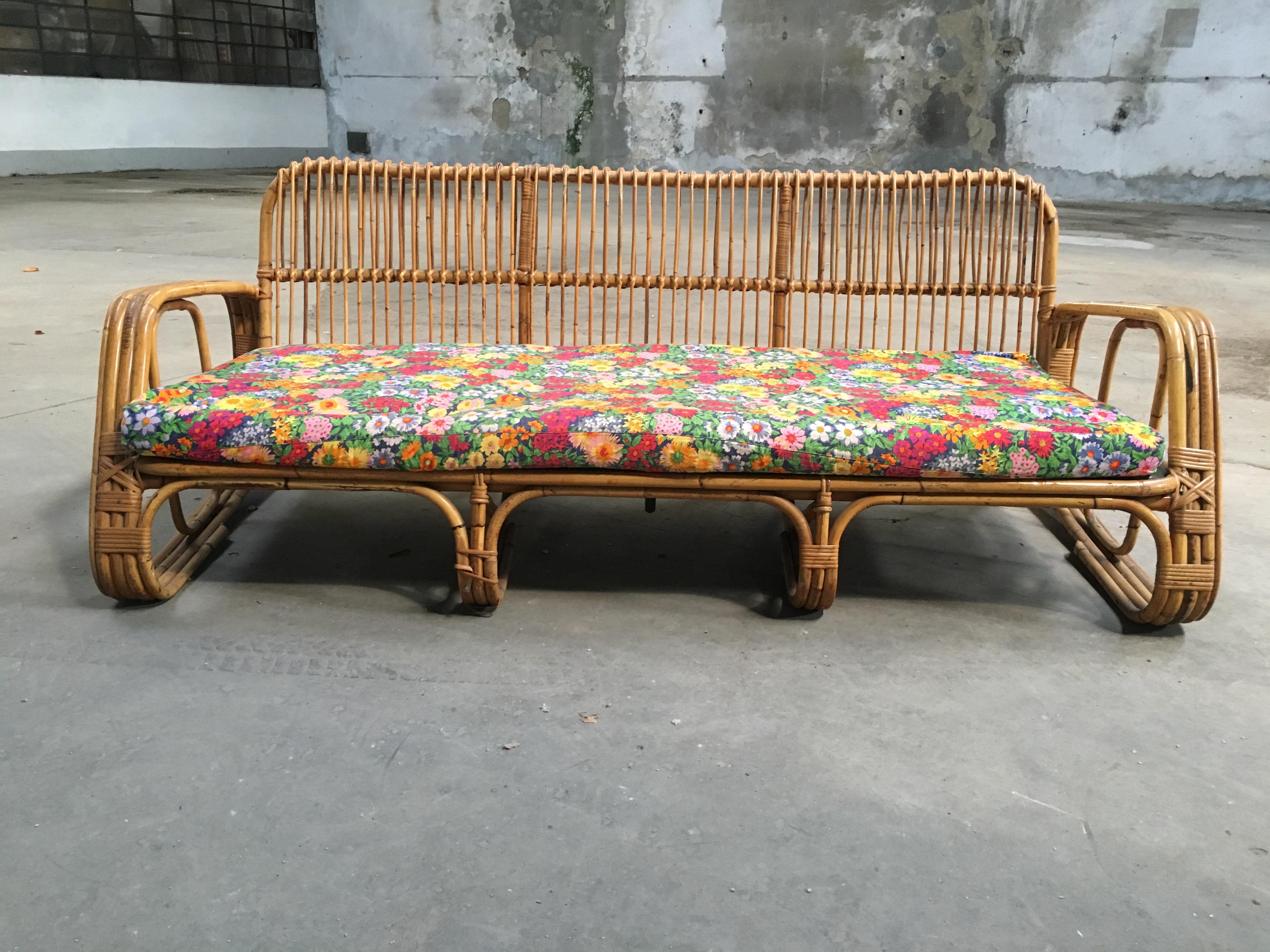 Mid-Century Modern Italian three-seat bamboo sofa with original floral cushions from 1960s.
This sofa could be sold together with the pair of bamboo armchairs visible in the pictures.
The sofa could also become a couple with another identical sofa