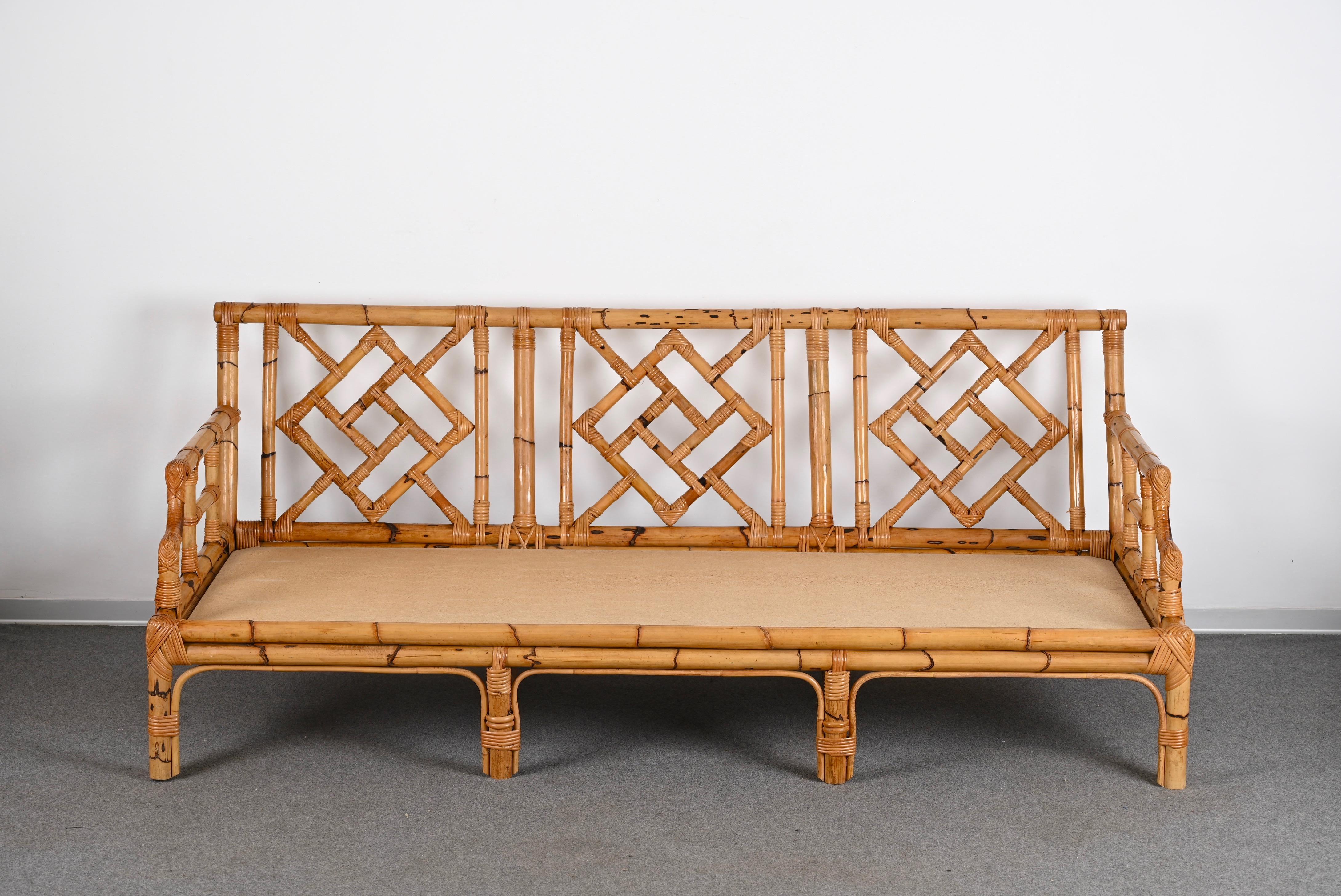 Iconic Mid-Century Modern three-seat sofa in bamboo and rattan. This amazing piece was produced by Vivai del Sud in Italy during 1970s. 

This wonderful hand-crafted sofa has a structure in curved bamboo and woven rattan with beautiful