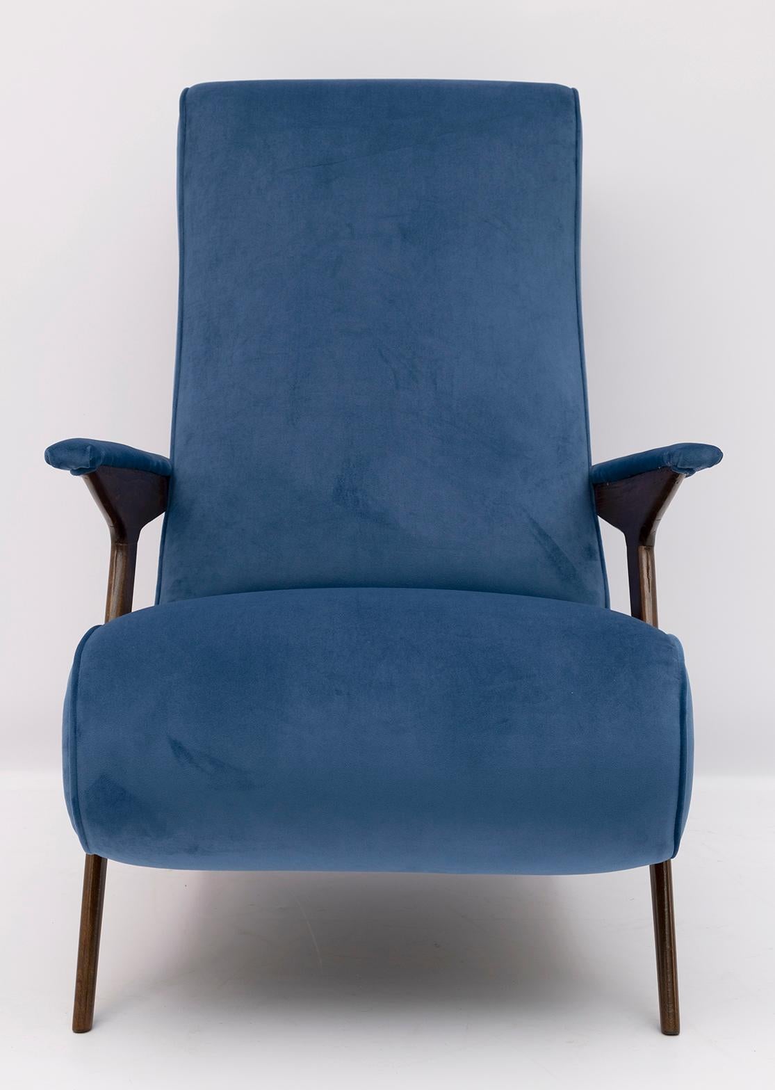 This particular Italian armchair, by an unknown designer, has been restored and upholstered in blue velvet. Armchair from the 1950s.
