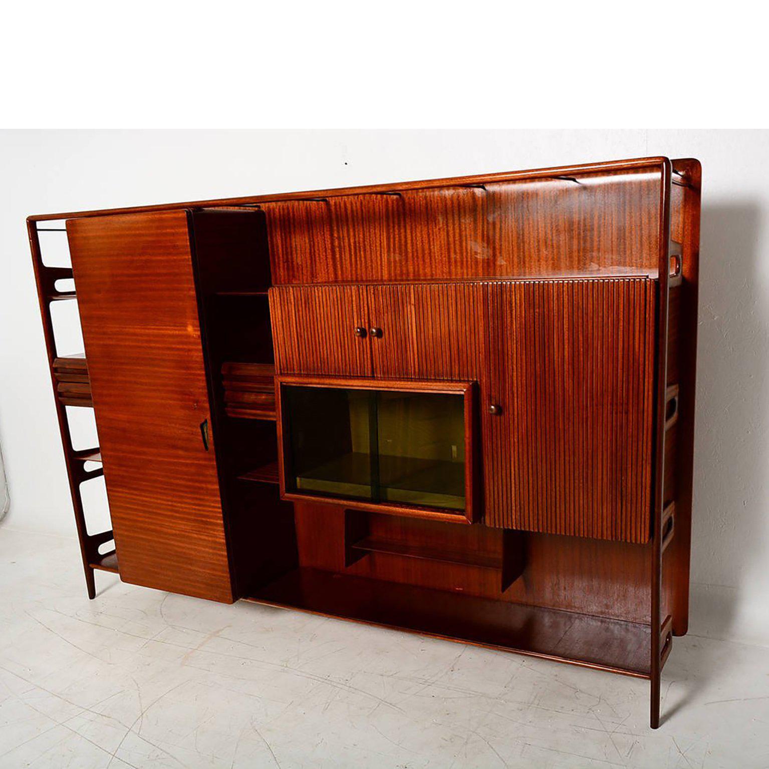 For your consideration a vintage wall unit constructed with mahogany wood.

Sculptural shape features multiple drawers, storage and open shelves.

Beautiful sculptural shapes. Unmarked.
