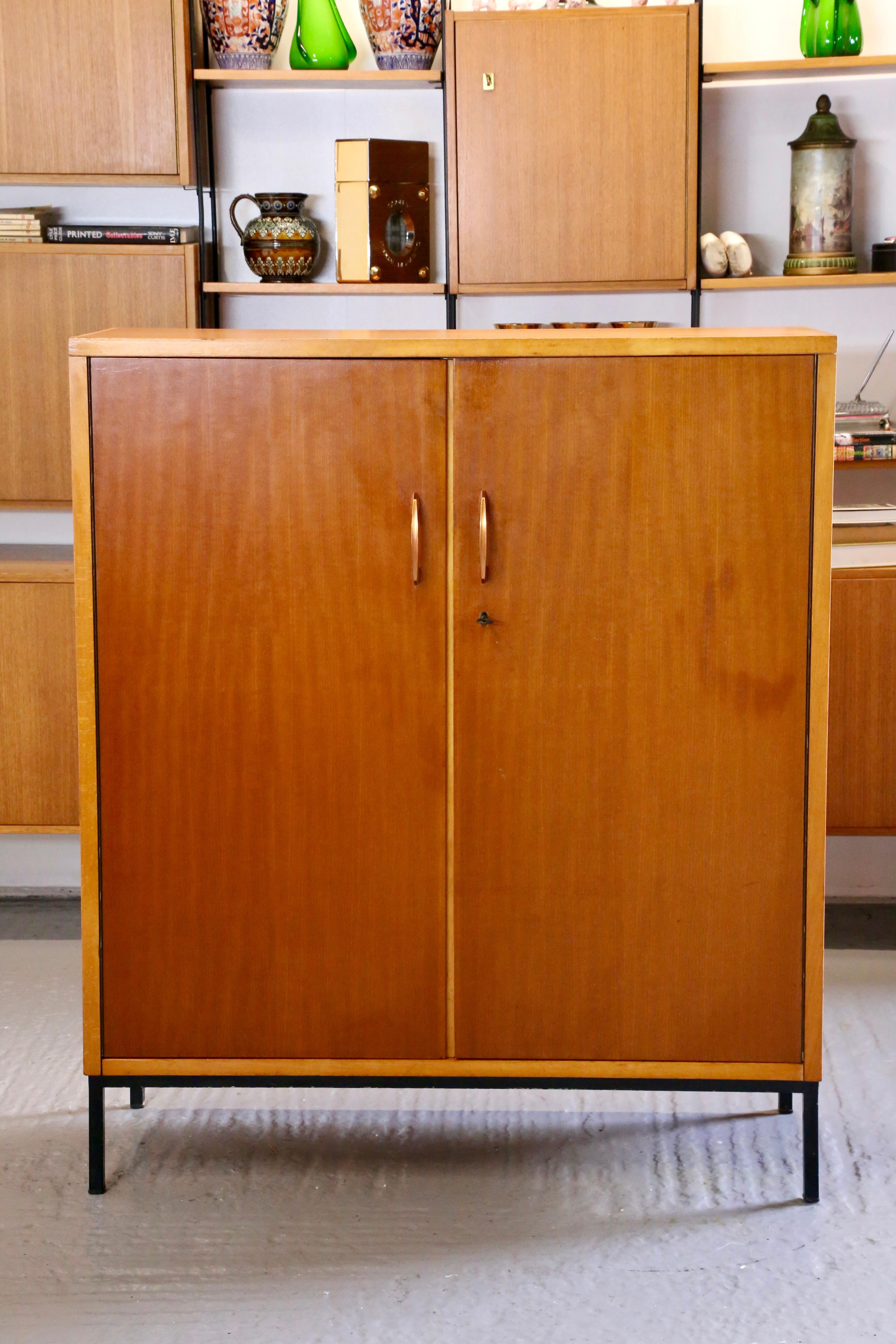 Sophisticated Simplicity: Mid-Century Modern Italian Walnut & Maple Cupboard On Stand by Dal Vera

Elevate your space with the timeless elegance of the Mid-Century Modern Italian Walnut & Maple Cupboard On Stand crafted by the esteemed designer Dal