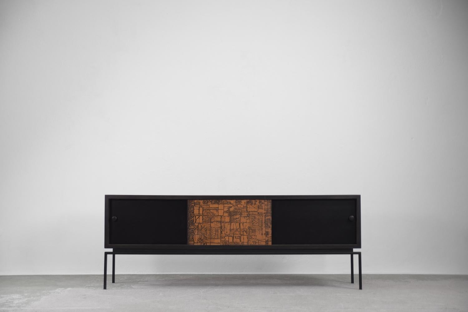 This modernist sideboard comes from Italy and was made during the 1970s. The chest is made of walnut wood with a rare, highly valued grain. The characteristic swirls and matting of the grain lines, together with the deep colors, create the illusion