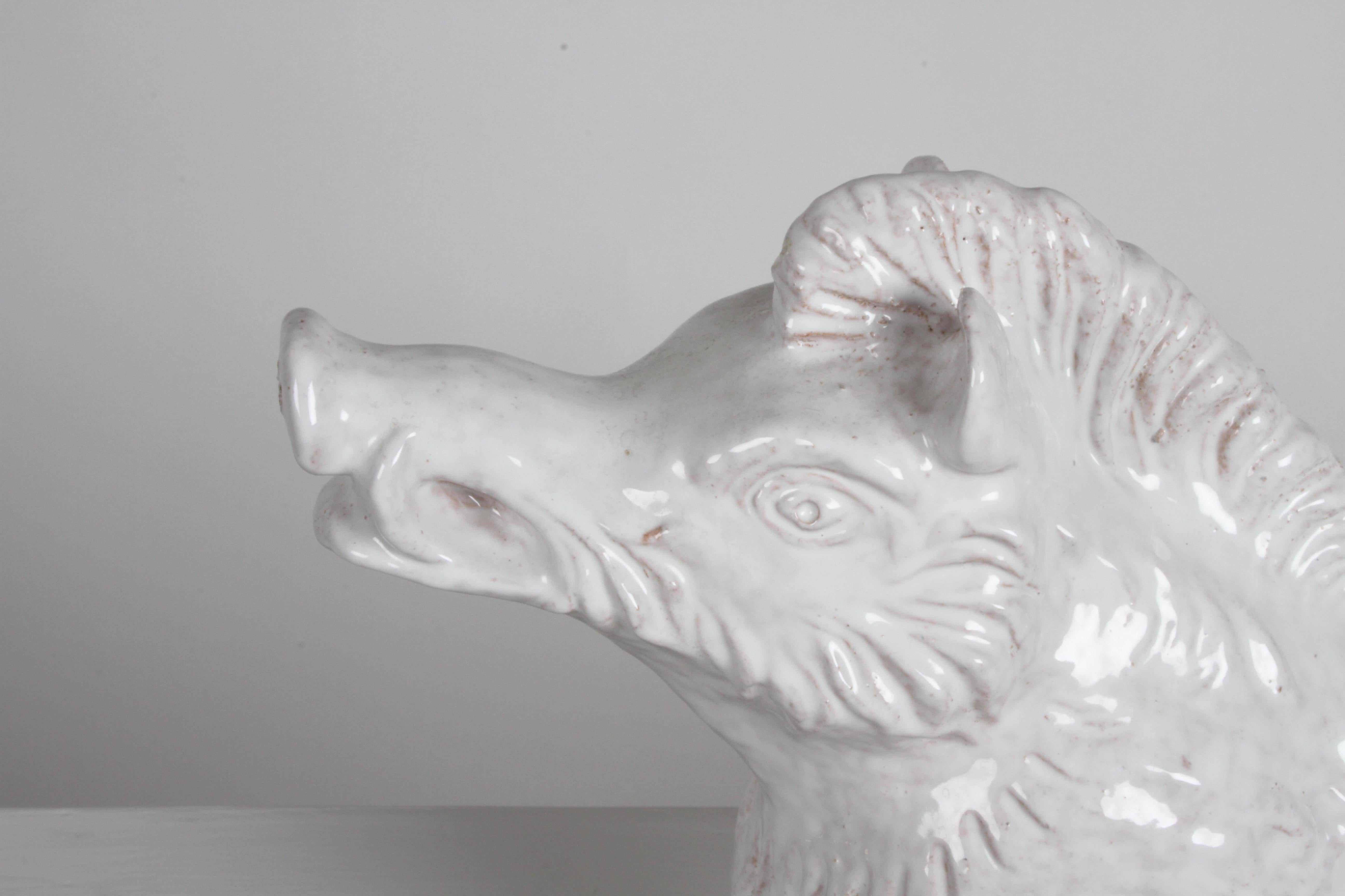 Mid-Century Modern Italian white glazed terracotta wild boar statue in the style Aldo Londi Bitossi for Raymor. Statue is free of repairs, signed with artist initials to underside, plus Italy.