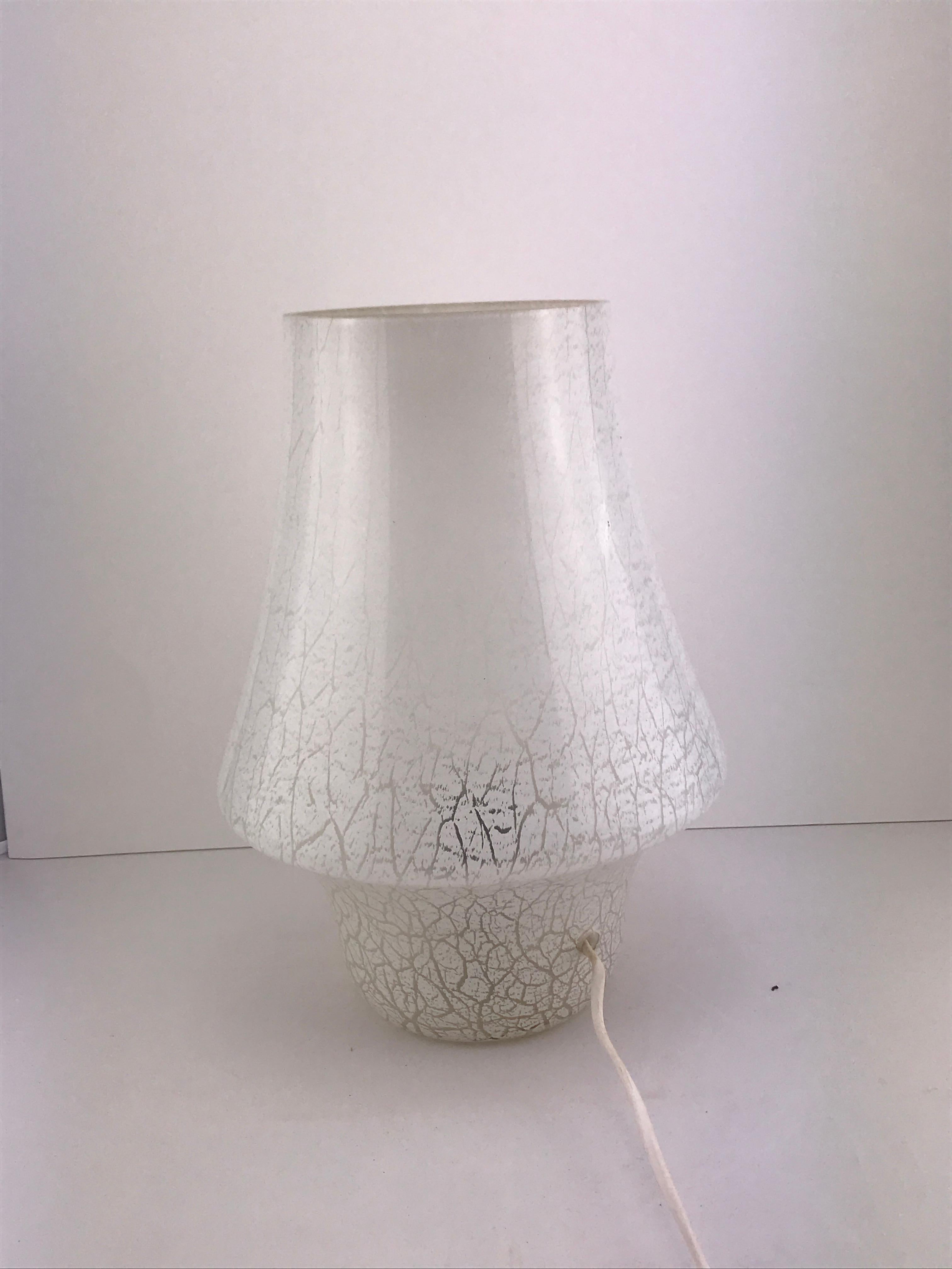 Mushroom Italian lamp in Murano glass, 1960s.
Good condition considering the age the white glass is still very beautiful and the light the come out is nice and gentle not invasive at all and makes this lamp perfect for a bedroom.  
  