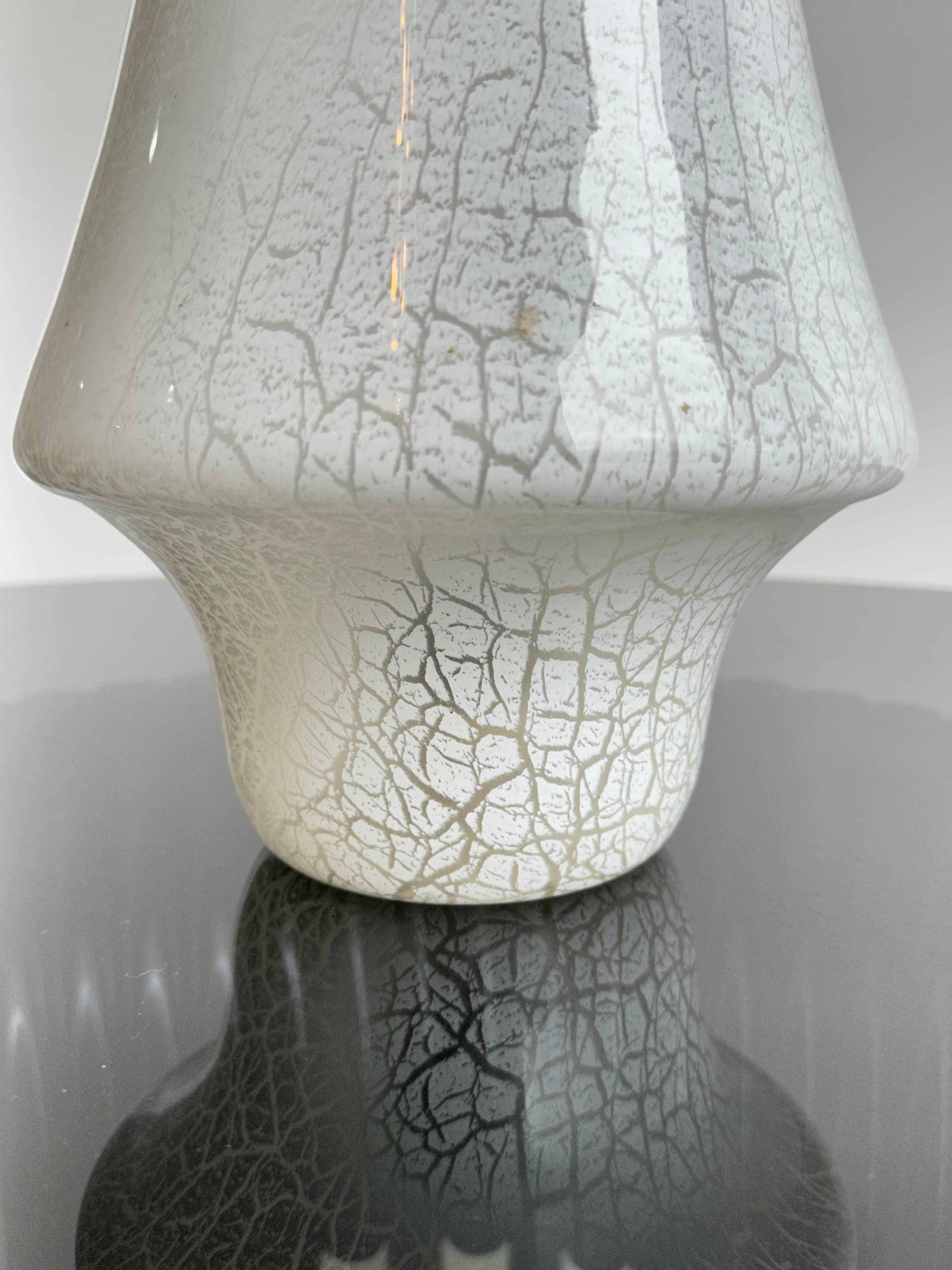 Mushroom Italian lamp in Murano glass, 1960s.
Good condition considering the age the white glass is still very beautiful and the light the come out is nice and gentle not invasive at all and makes this lamp perfect for a bedroom.  
  