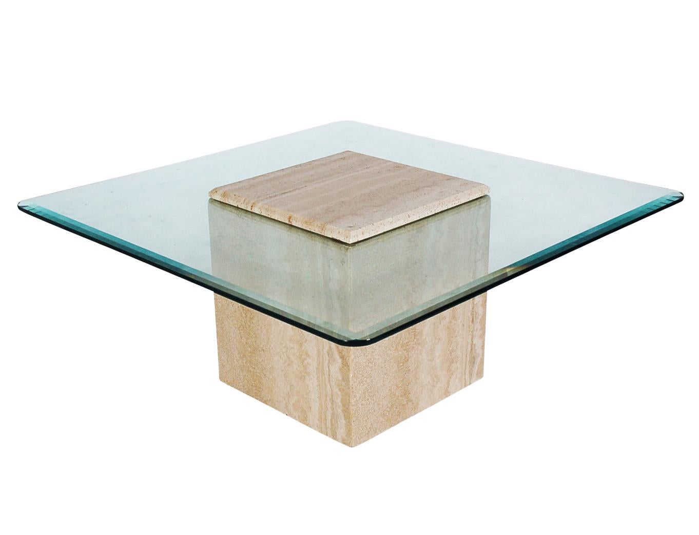 A chic and modern designed coffee table made in Italy, circa 1978. This table consists of heavy a heavy thick travertine base with a floating clear piece of glass. Very well cared for and ready for immediate use.