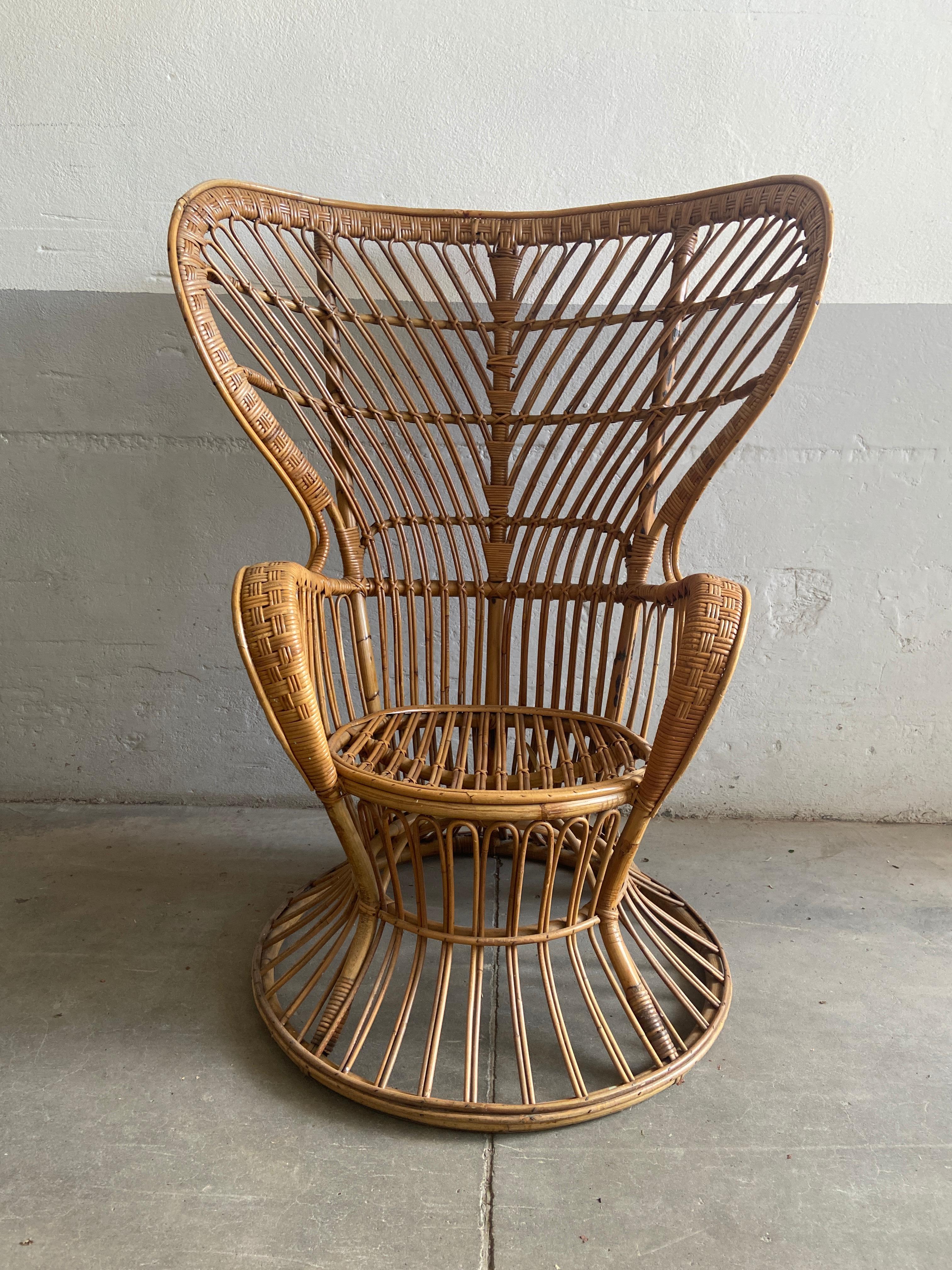 Wicker wingback chair designed by Lio Carminati, 1950. 
Lio Carminati and Gio Ponti originally designed this chair for the luxury ocean liner Conte Biancamano. 
This model of a wingback chair was used by Carlo Mollino for his erotic polaroid