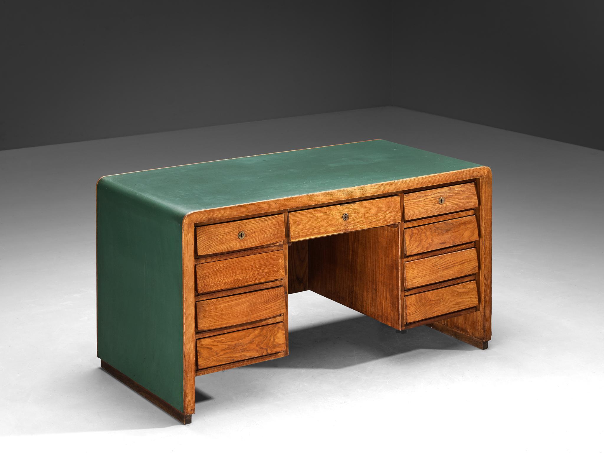 Writing desk, oak, type of plastic, Italy, 1953

An exquisite Italian-crafted office desk commands attention with its captivating form and distinctive material composition. Reflecting the essence of mid-century modern design from Italy, this desk