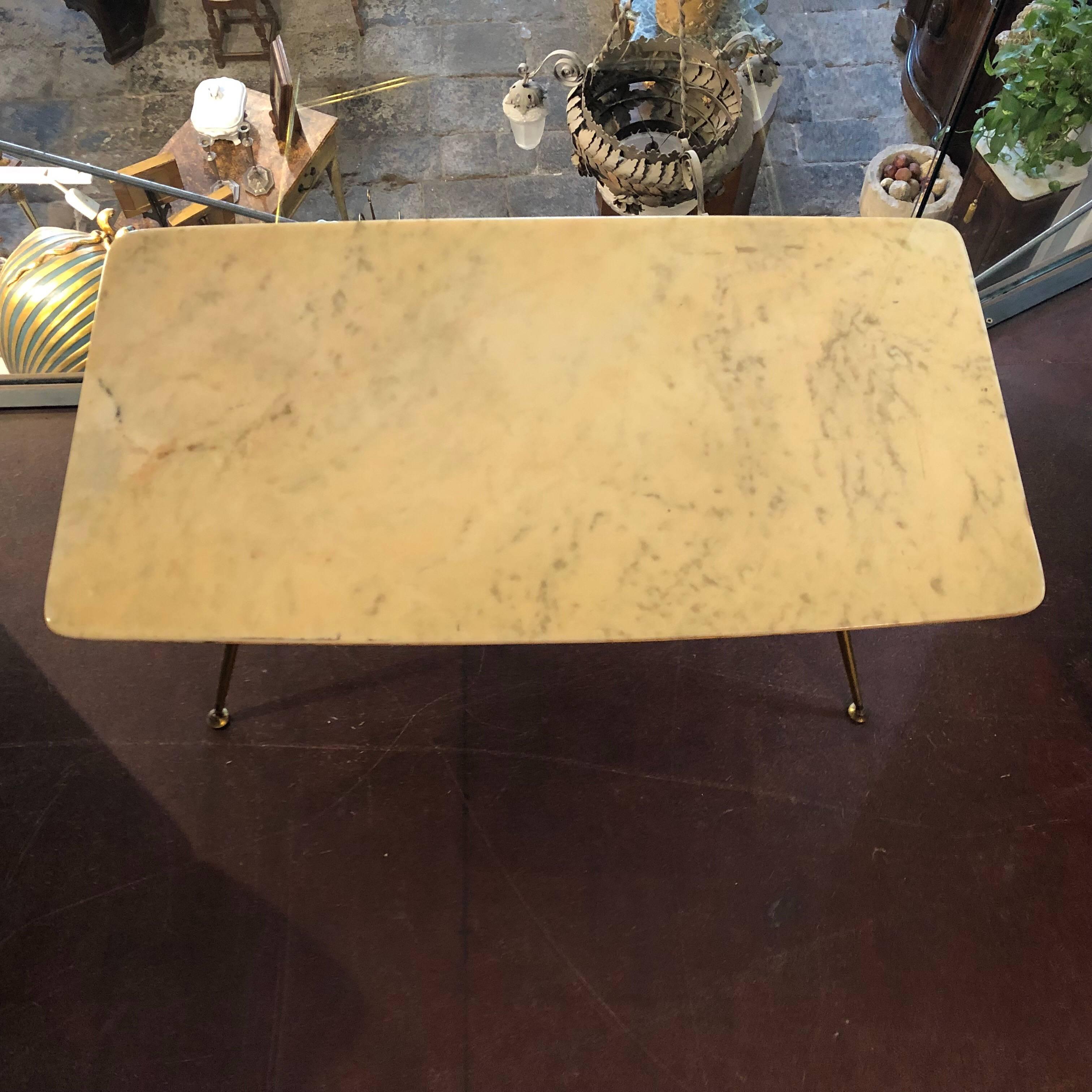 This is a brass and yellow marble coffee table in the style of Ice Parisi. Brass in original patina create a vibrant vintage look. Marble is in perfect conditions.