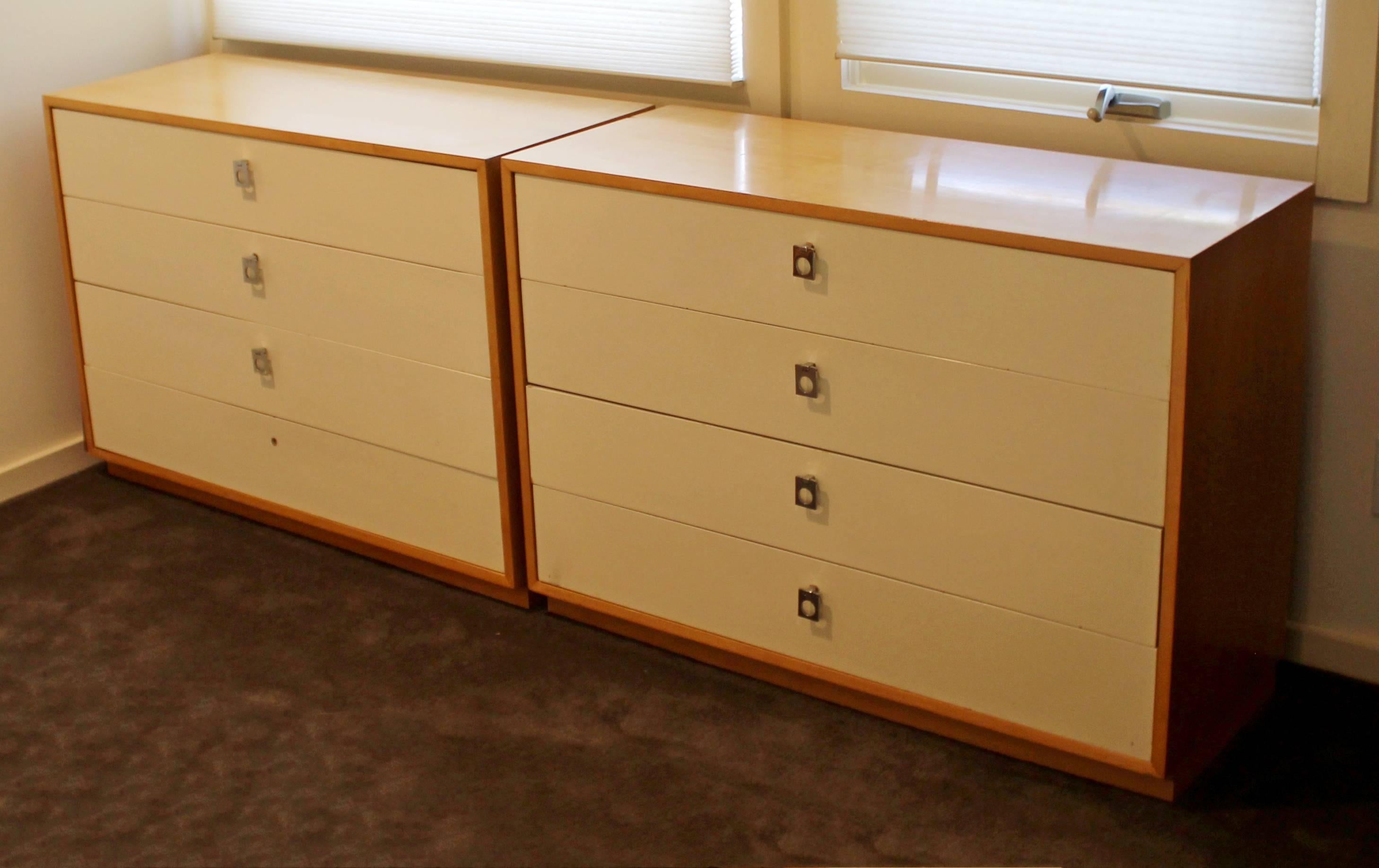 For your consideration is a fabulous pair of maple dressers, with four drawers each and original chrome pulls, by Jack Carwright for Founders, circa 1960s. In very good condition, but is missing one of the pulls. The dimensions of each are 40