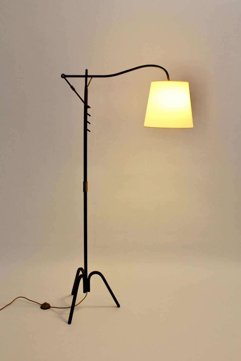 Mid Century Modern vintage adjustable floor lamp from black iron and brass details attributed to Jacques Adnet 1950s France.
The floor lamp shows no marker´s mark, attributed to Jacques Adnet 1950s France.
Four positions to adjustable the lamp shade