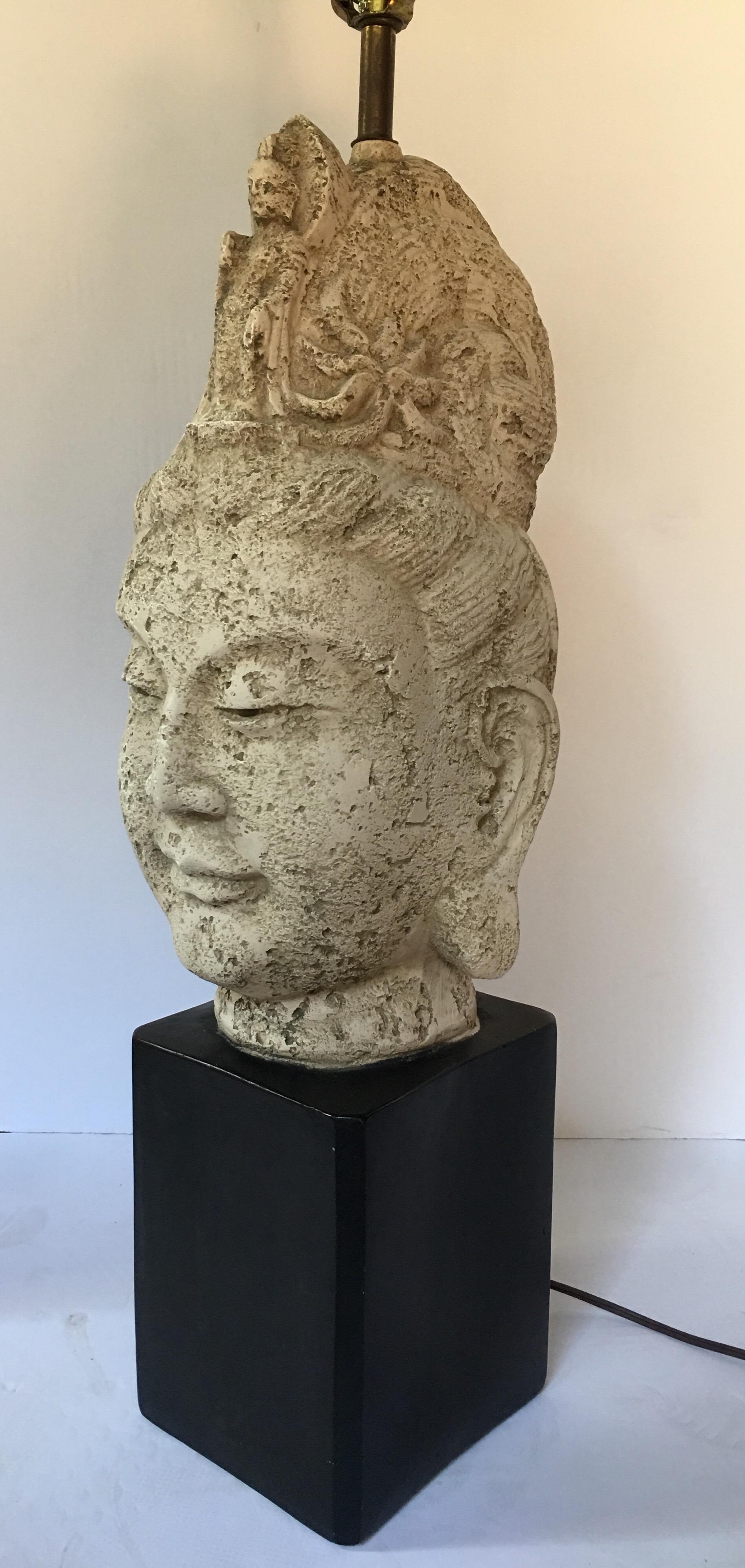 Mid-Century Modern sculptural plaster Asian Buddha head bust table lamp in the style of James Mont. Textural grey faux stone finish. Lampshade not included. Measures: 29.5 high to top of socket.