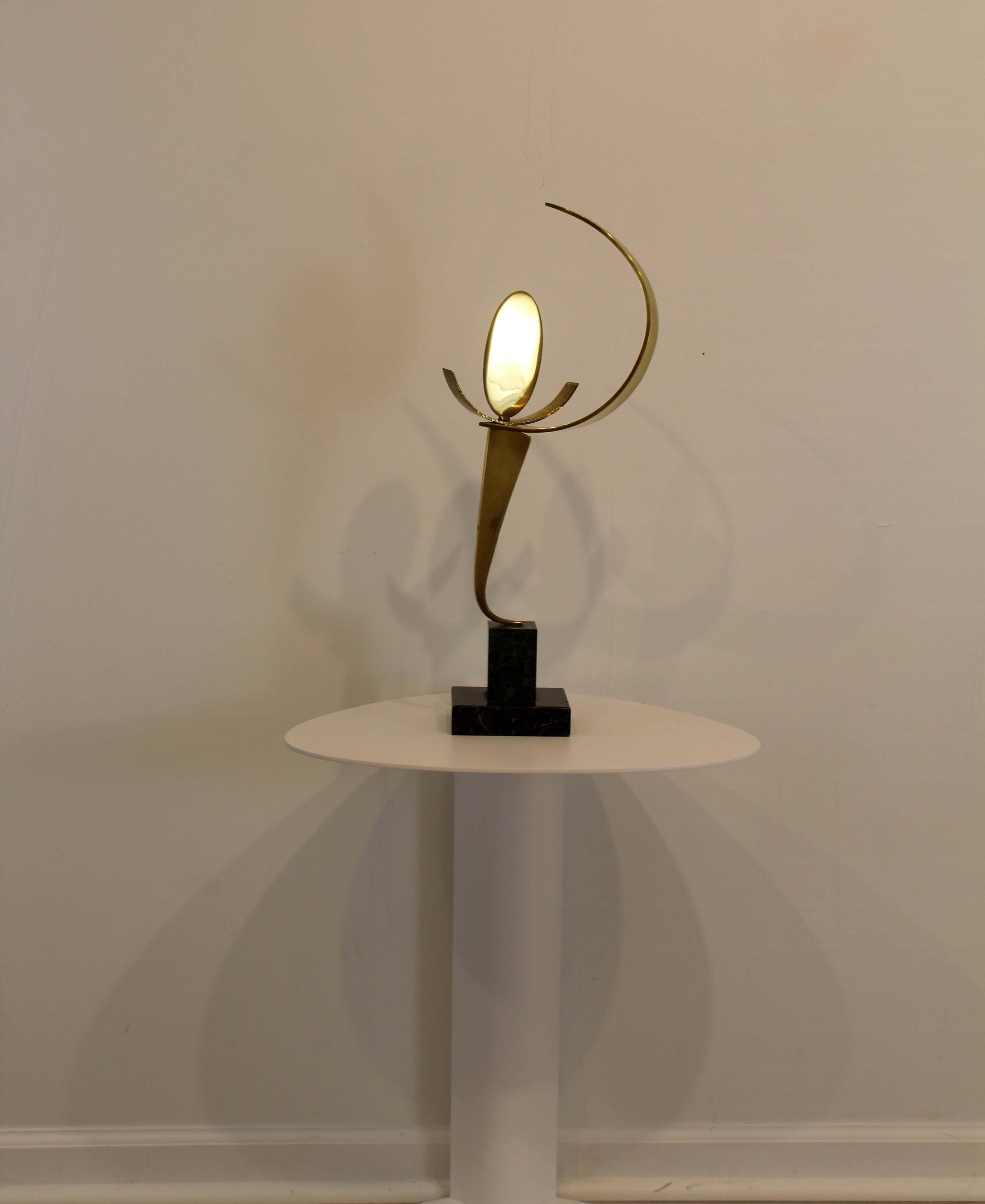 A dynamic modern brass sculpture titled Eclipse 12 by Detroit sculptor James Nani. The geometric forms in this sculpture are simply stunning that creates a sense movement. Circa 1970s. Dimensions: 21.75 H x 4.75 D x 7 W. In excellent vintage