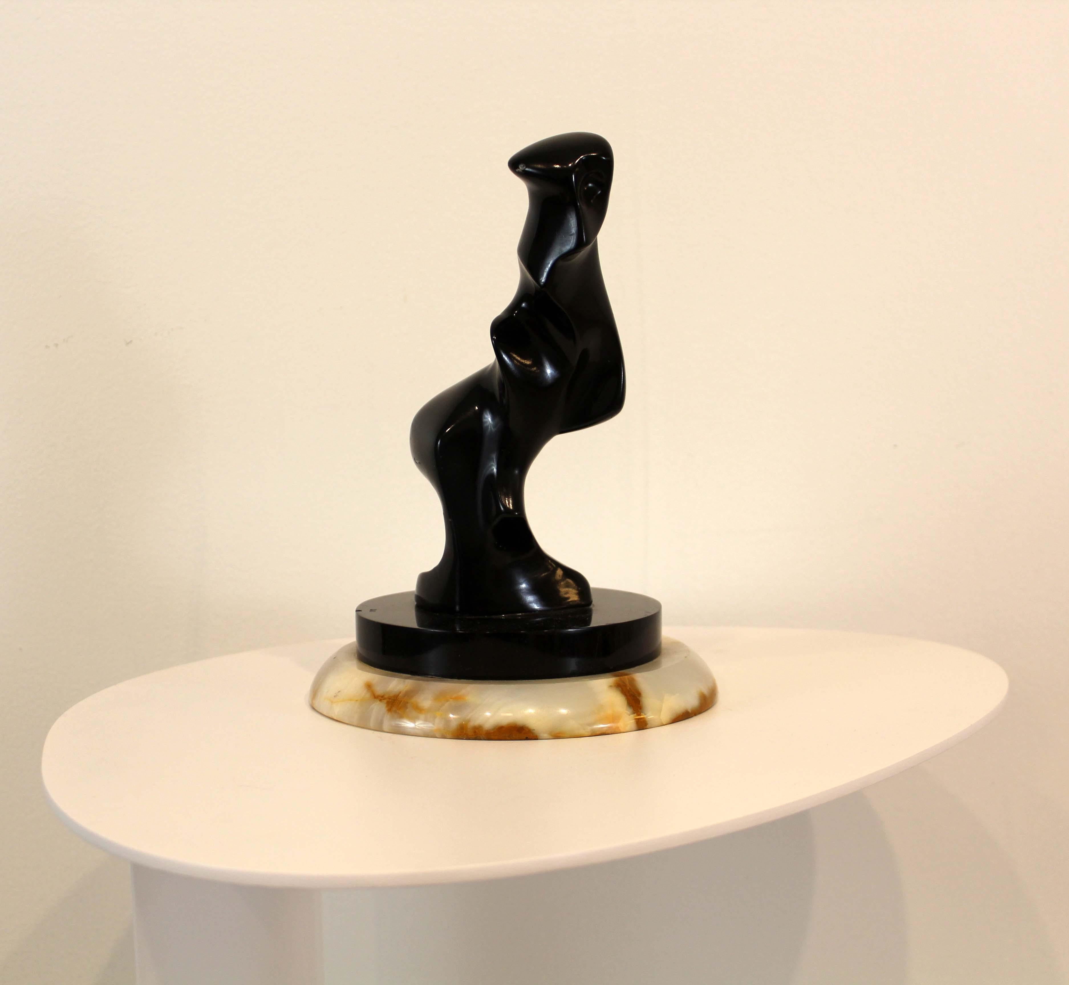 A stunning modern form sculpture on a modern base titled Famous by Detroit sculptor James Nani. Circa 1970s. Dimensions: 9h x 6.75 diameter. In excellent condition.

 James Nani (1926-2016) was a Detroit artist for over 50 years and is known