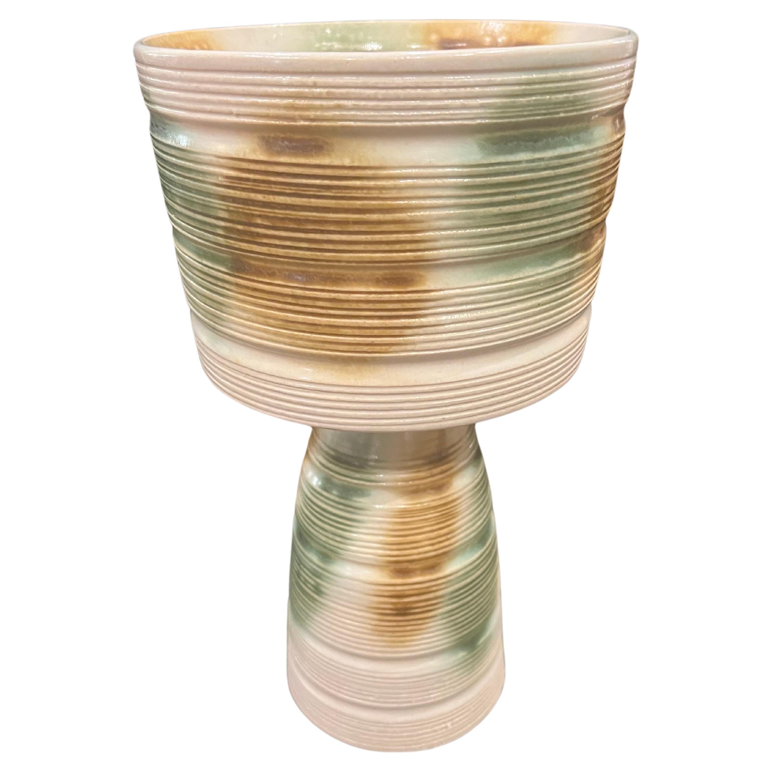 Beautiful earth tones color glaze, design, and shape on this ceramic, shape Ikebana bowl or planter.