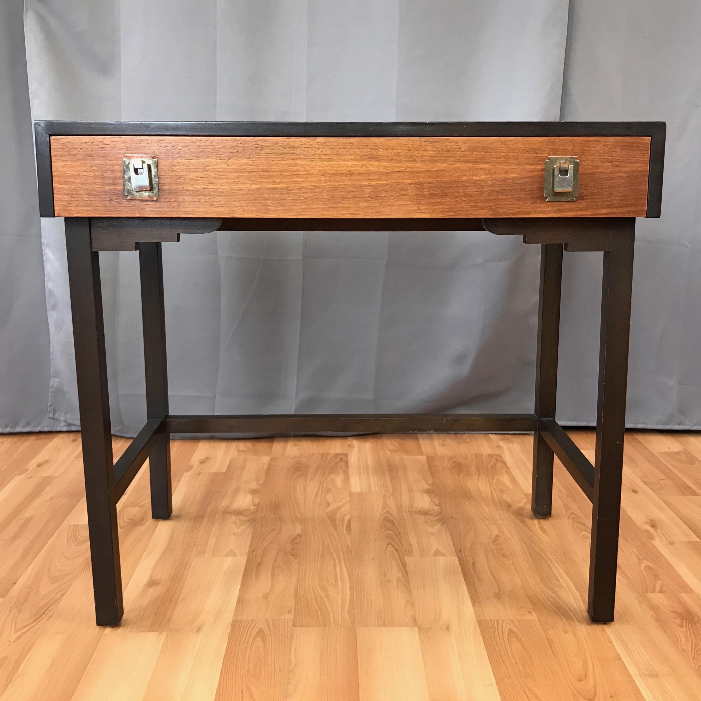 A 1950s elm vanity or small desk with drawer, made in Japan.

Has a clean Mid-Century Modern design that would complement pieces by McCobb, Knoll, and Nelson, with a few Asian-style touches that set it apart.

Features a three-tone finish—caramel