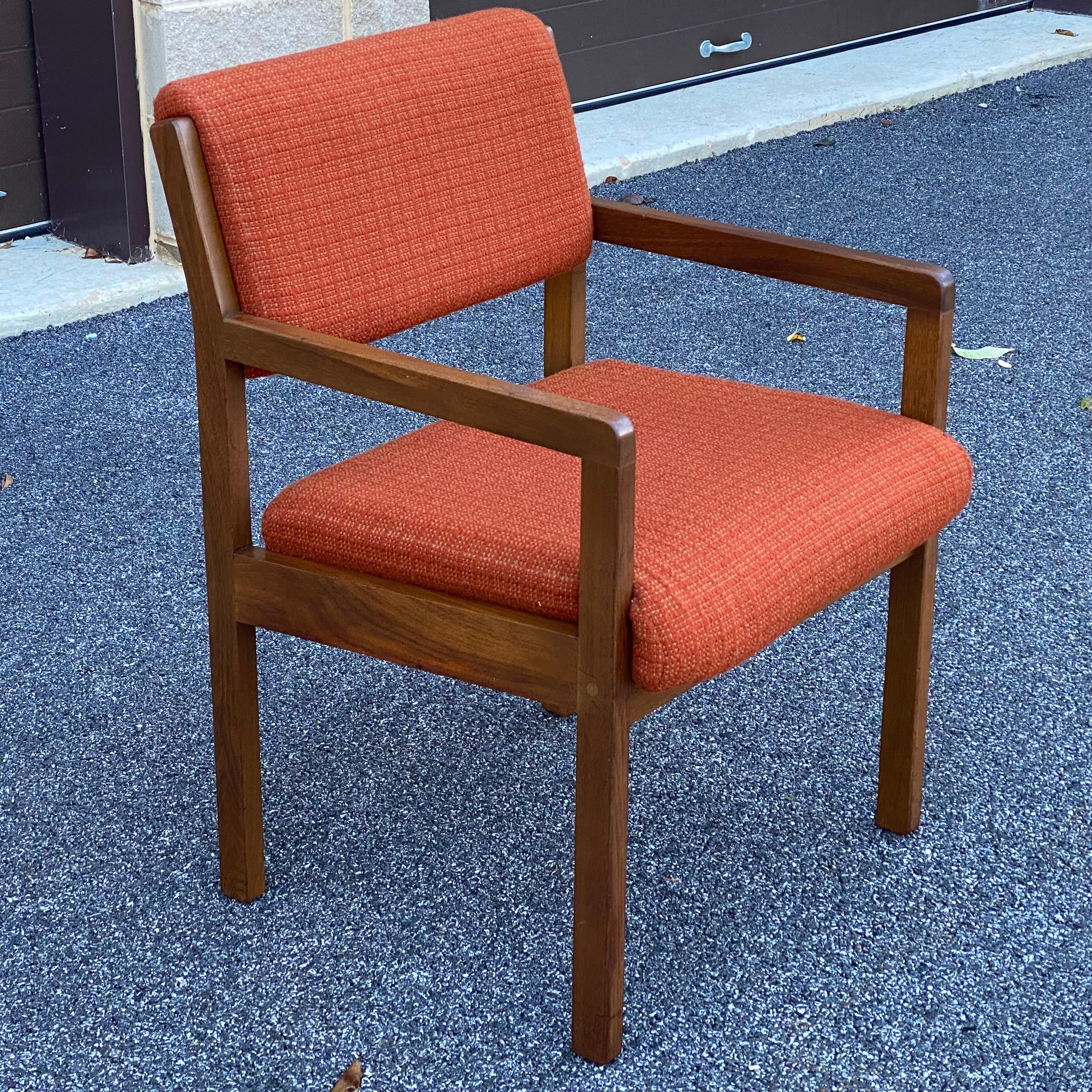 Jens Risom solid walnut arm chair with the original burnt orange upholstery for Risom/Marble Corporation with the original tags intact underneath. 