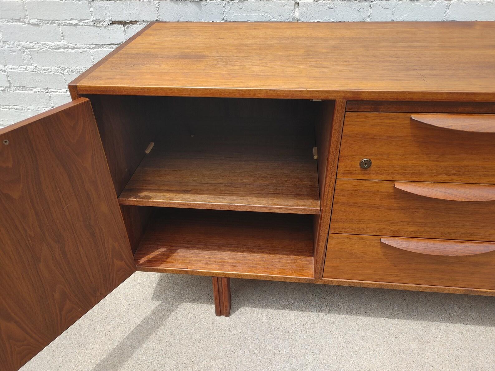 Mid Century Modern Jens Risom Walnut Credenza

Above average vintage condition and structurally sound. Has some expected slight finish wear and scratching. Top has been refinished and does not have original factory finish. Finished back. I do not