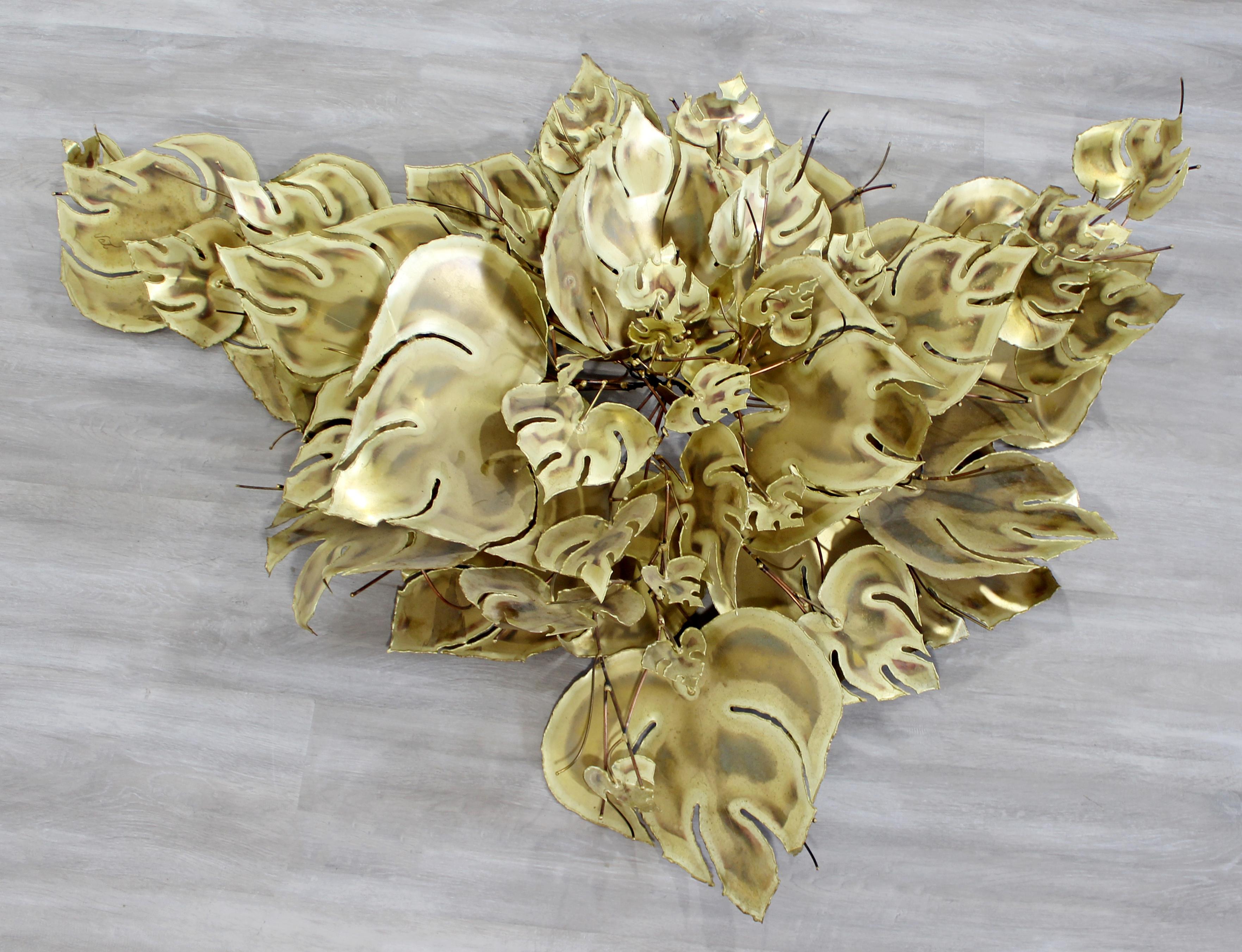 For your consideration is a beautiful, torchcut brutalist brass leaves branch wall sculpture, signed Stephen Vat, in the style of Curtis Jere. In excellent condition. The dimensions are 48