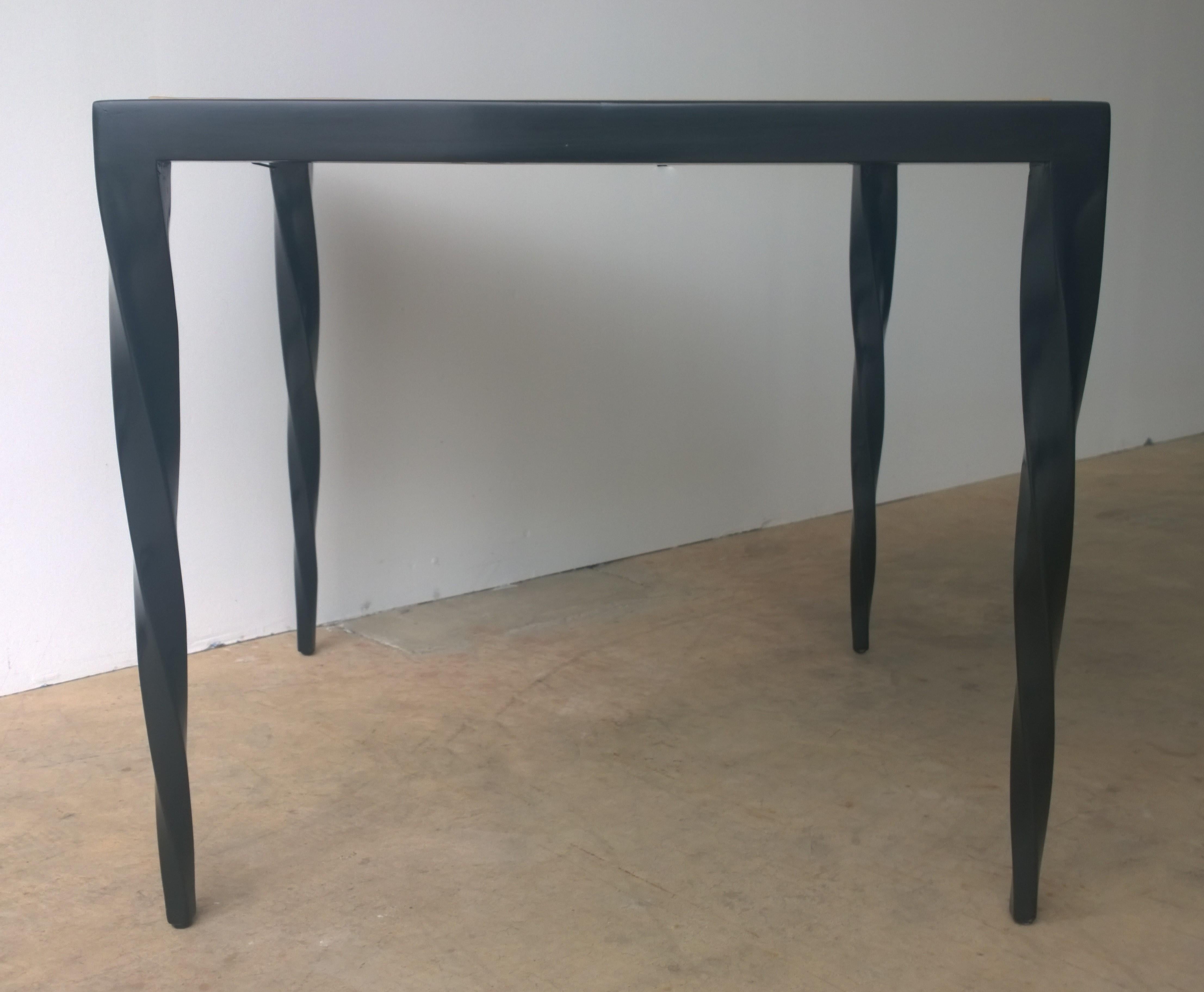 Offered is a Mid-Century Modern Johan Tapp square game table or small dining table with an ebony frame, tan leather top and four carved ebony legs. Johan Tapp designed and produced intricate wood pieces for Gumps department store in the 1940s-1950s.