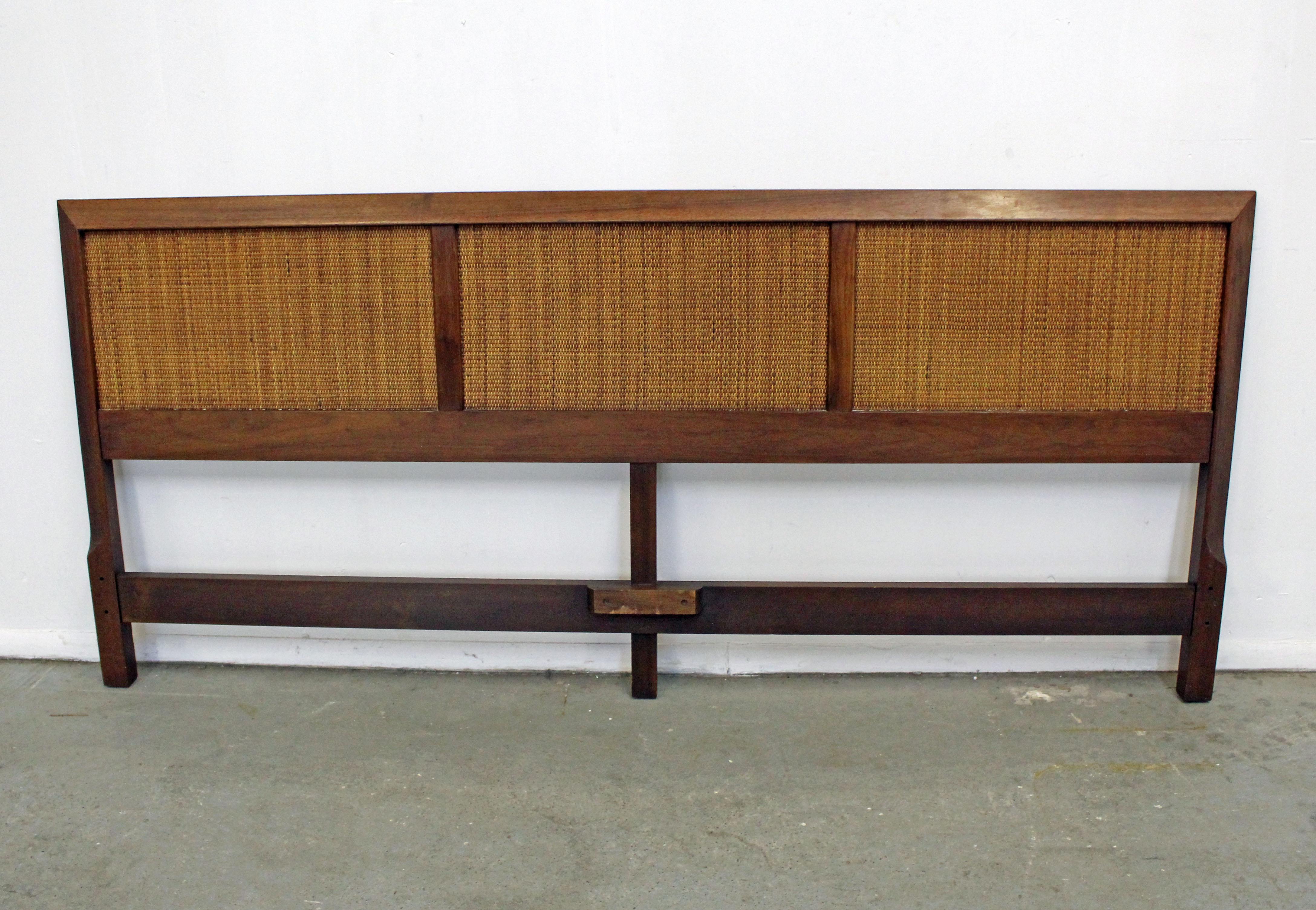 Offered is a vintage mid-century walnut and cane king-size headboard similar to the style of John Stuart. It is in good condition, shows slight age wear (surface scratches/chips-see pictures). It is not signed. See our other listings for more