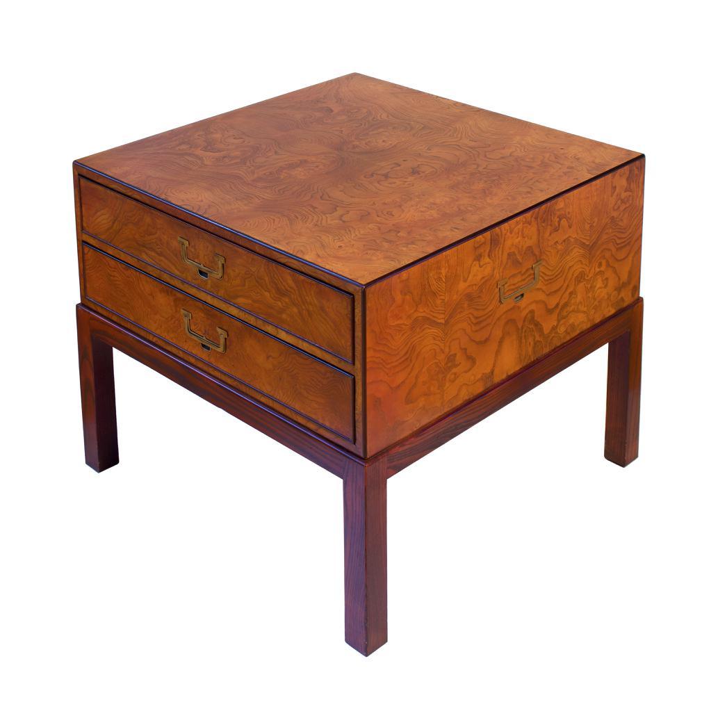 Mid-century Modern John Widdicomb Side Table, Grand Rapids, MI, circa 1970.
A campaign style two drawer square chest-on-stand, functioning as a side table influenced by Japanese design. Crafted from Japanese Zelkova (keyaki) burl veneer with