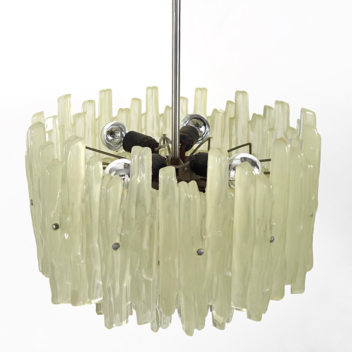 Majestic three stories high J.T. Kalmar chandelier or pendant with frosted glass icicles made of irregularly shaped plexiglass. They hang in a chrome frame. 
Four light sources provide for attractive lighting.
Height of the shade is 49 cm / 19.5