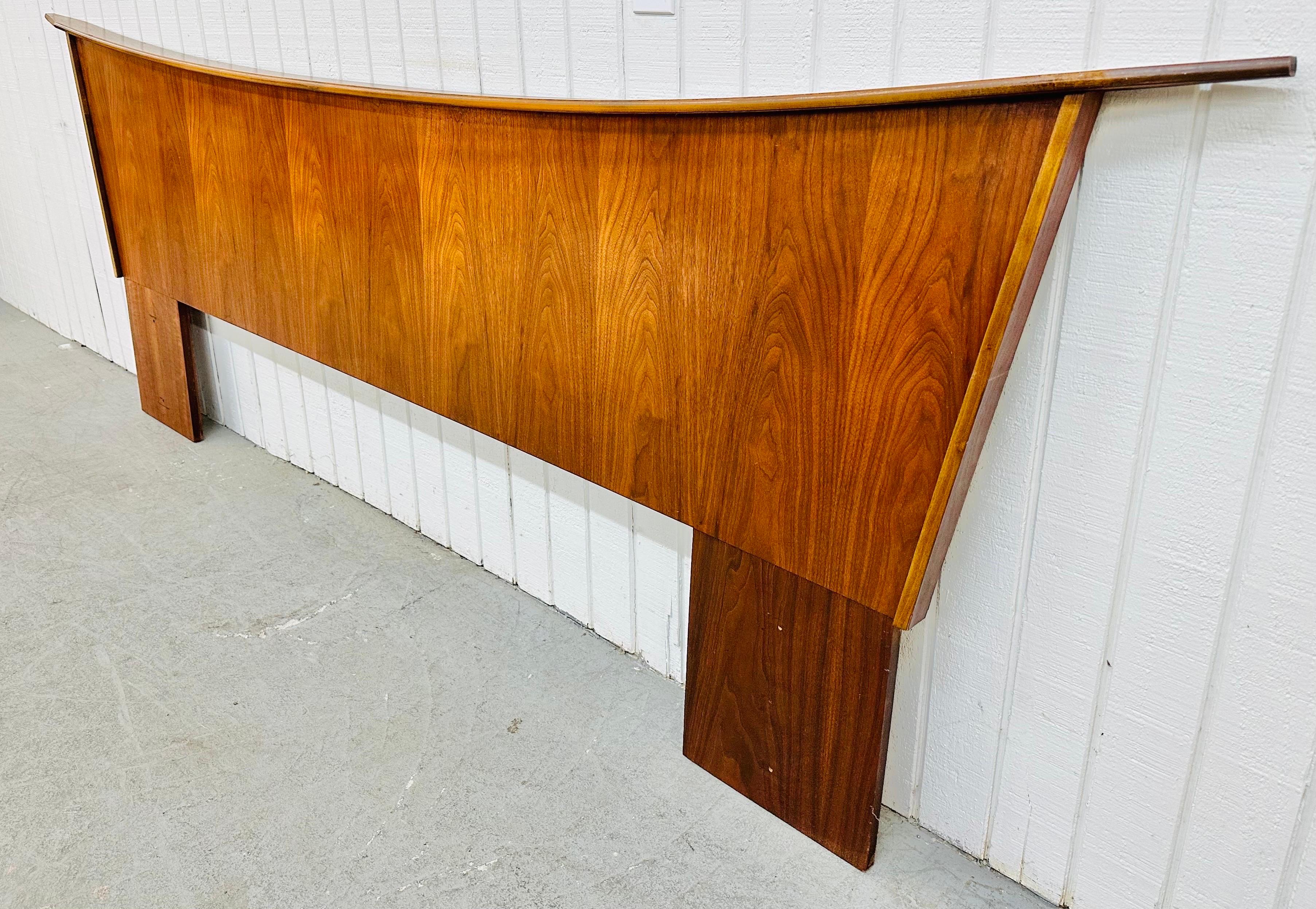 This listing is for a Mid-Century Modern Kagan Style Walnut King Headboard. Featuring a Kagan style curved  design, angled sides, and a beautiful walnut finish. This is an exceptional combination of quality and design!