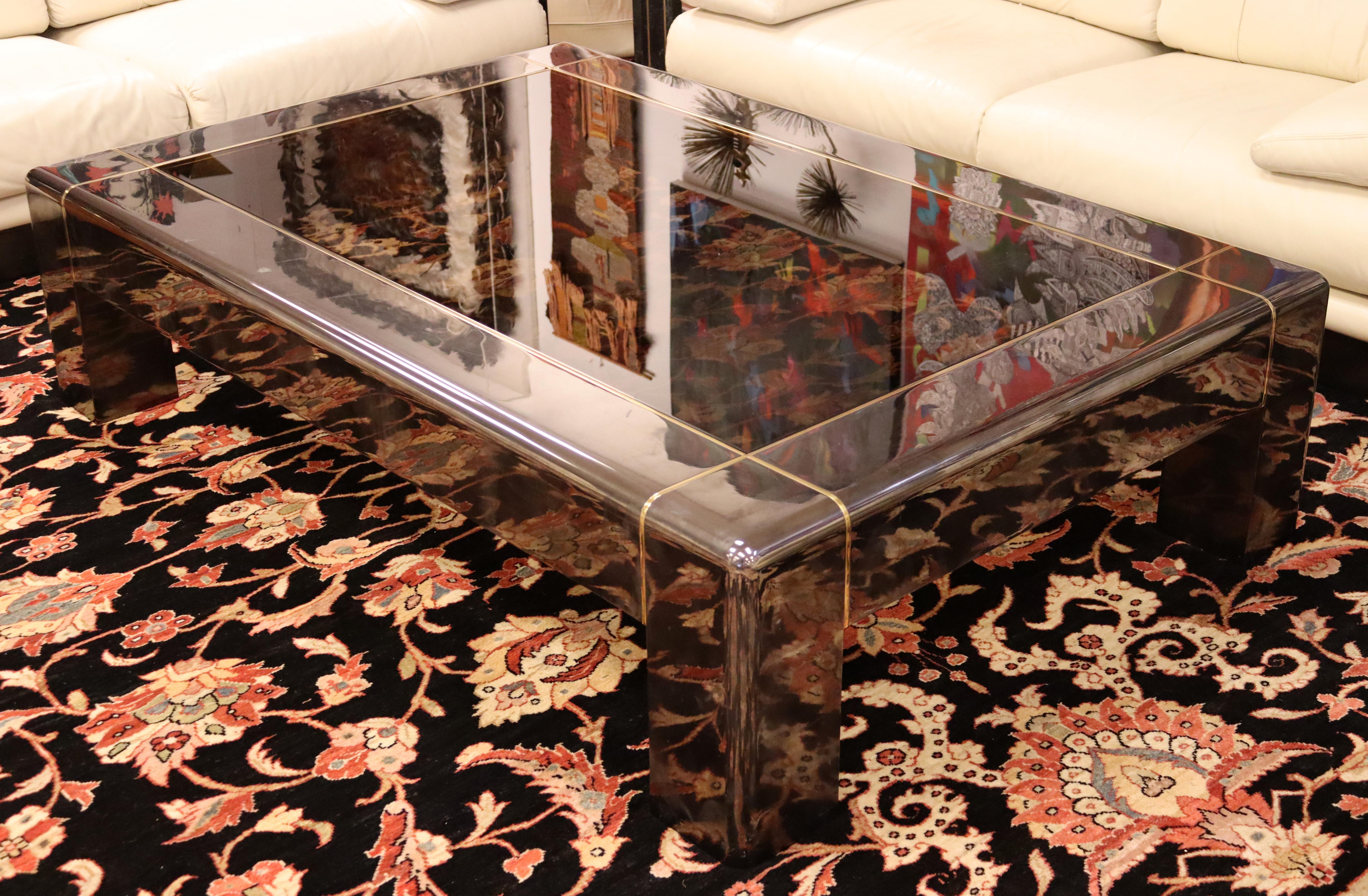 For your consideration is a fantastic, rectangular coffee table, with a smoked glass top on a metal base, attributed to Karl Springer, circa the 1970s. In excellent vintage condition. The dimensions are 65