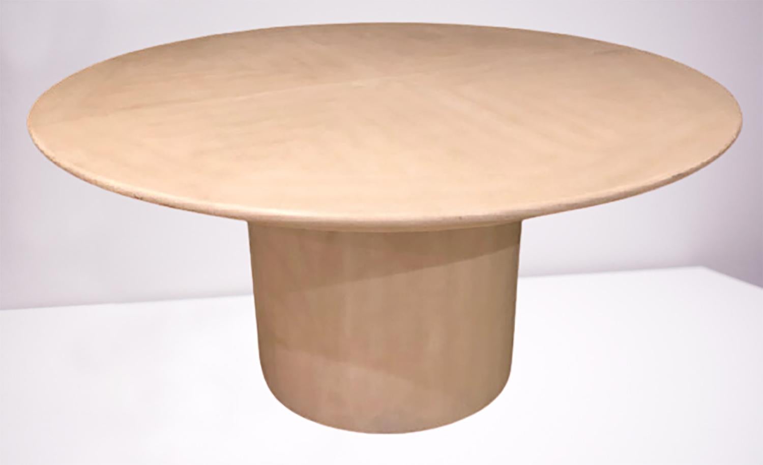 A Mid-Century Modern Karl Springer circular dining, conference or center table having three twenty inch leaves. The fine column form base supporting a circular table top. Extends to ten feet when fully opened with two wooden planks. Unsigned.
ZSGS