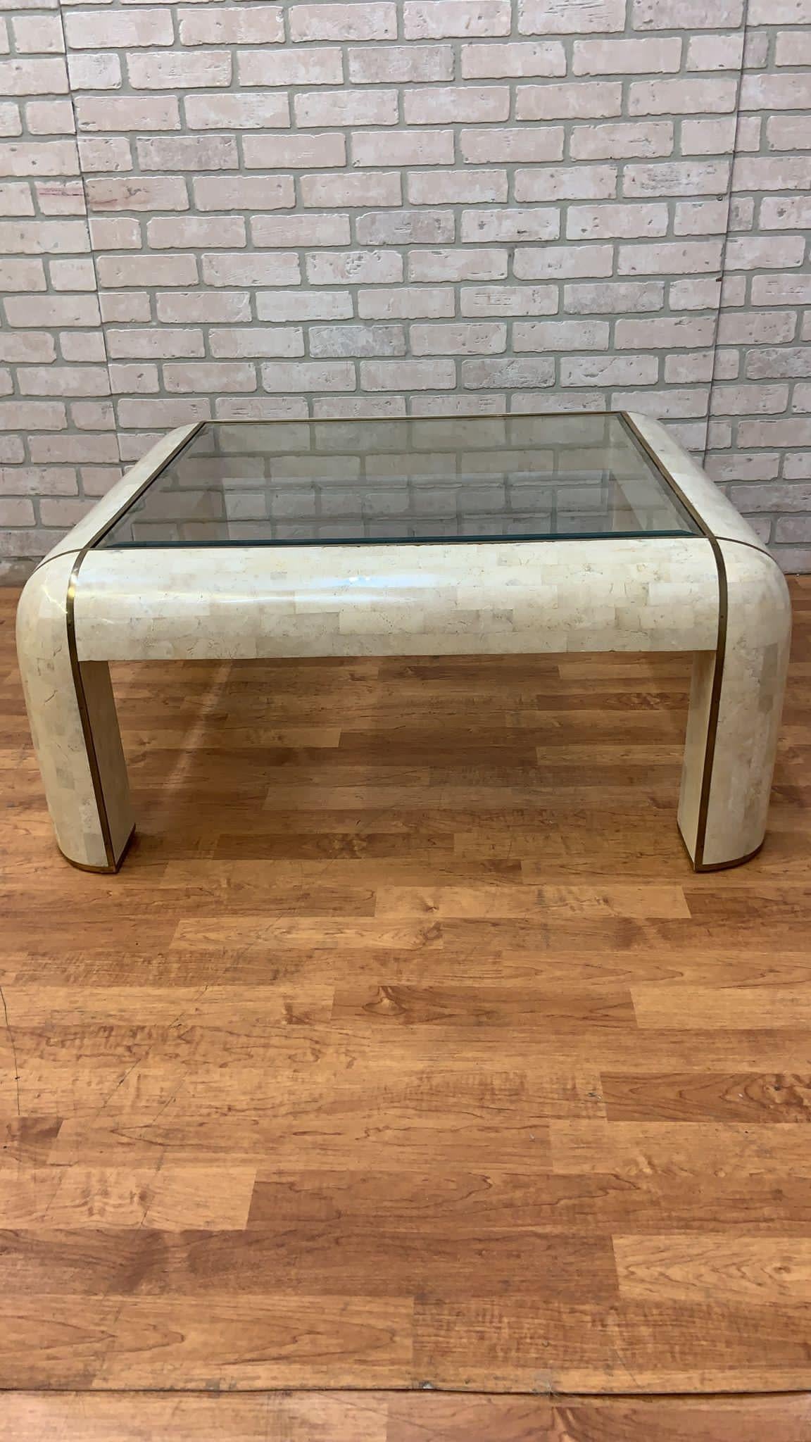 Mid Century Modern Karl Springer Style Tessellated Marble Coffee Table

Vintage Mid Century Modern Curve Form Tessellated Marble Coffee Table. This Table is Inlaid with brass banding and has a beveled glass inset top.

Circa 1970’s

Dimensions:
H: