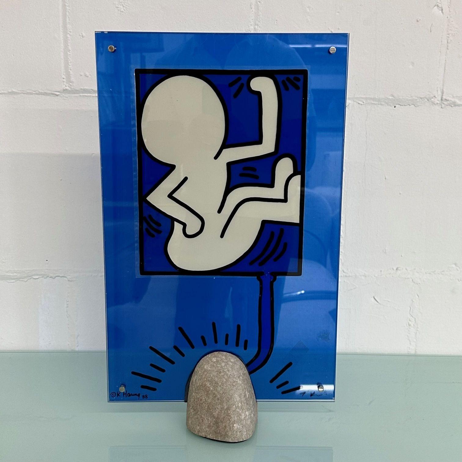 Mid-Century Modern Keith Haring Sculpture / Lamp, Glass and Stone, Signed, 1988

Limited edition Keith Haring and Toshiyuki Kita lamp. Comprised of reverse screen printed glass and stone. Signed and dated on the lower left hand corner. Matching lamp